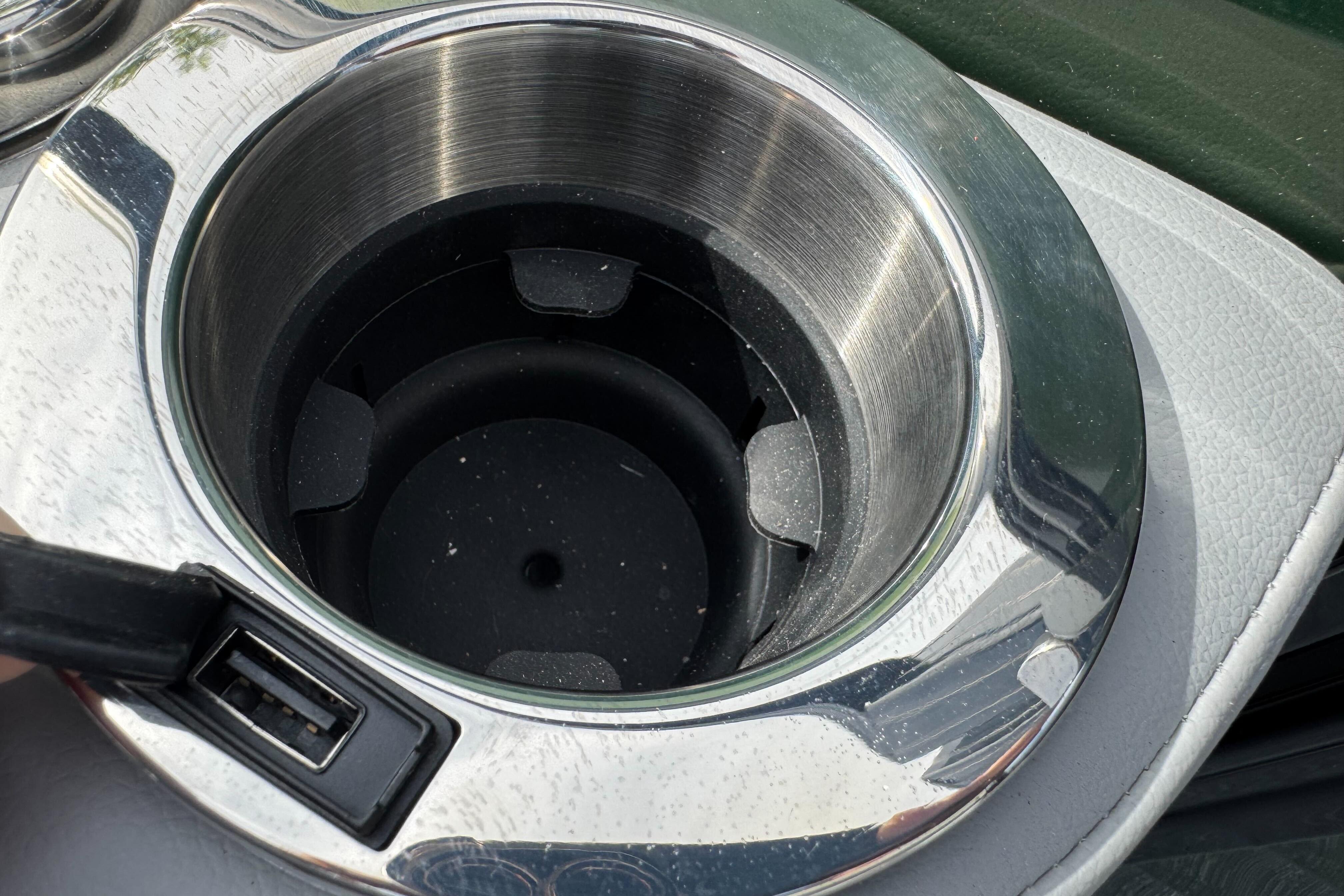 Cup holder with USB port in 2026 Regency 250 DL vehicle interior.