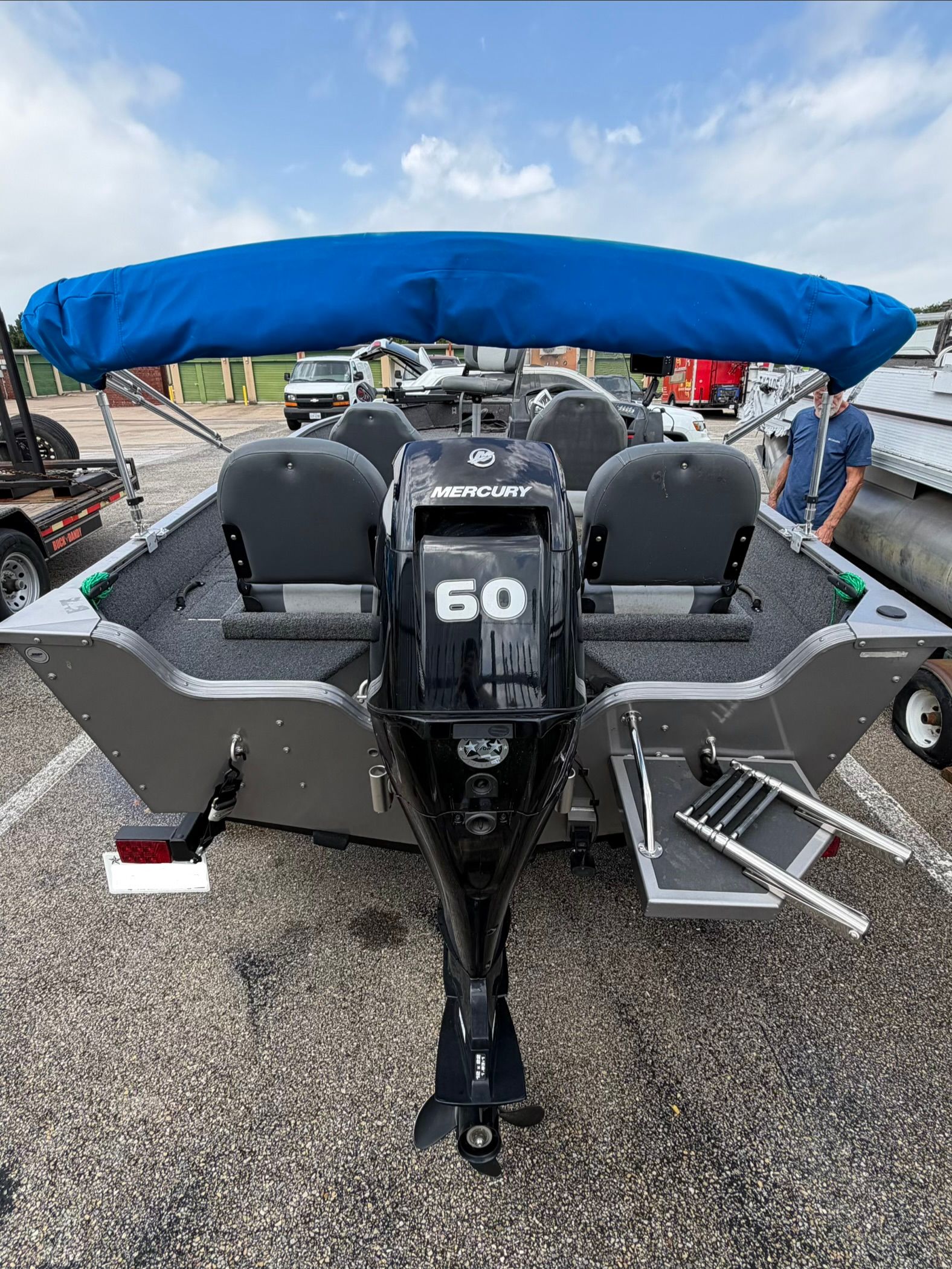 The image shows a Lowe Fishing Machine 1675SC boat with a Mercury 60 outboard motor.