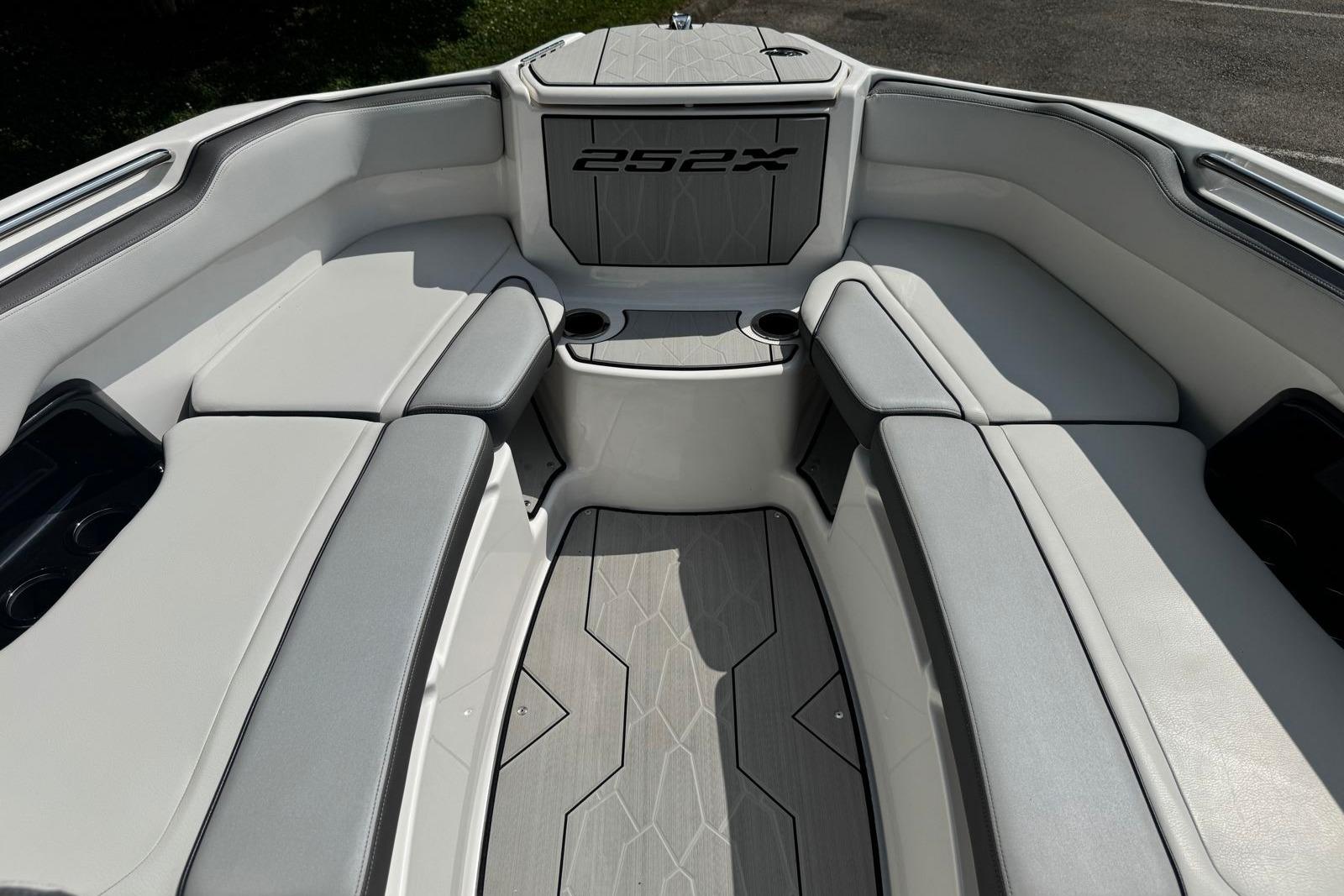 2023 Yamaha Boats 252XE interior with sleek seating and modern design.