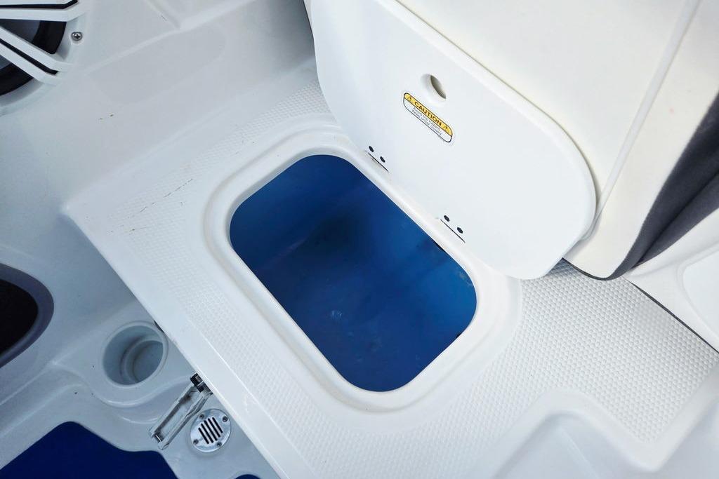 2018 Tahoe 450 TS boat interior storage compartment with textured white surface.