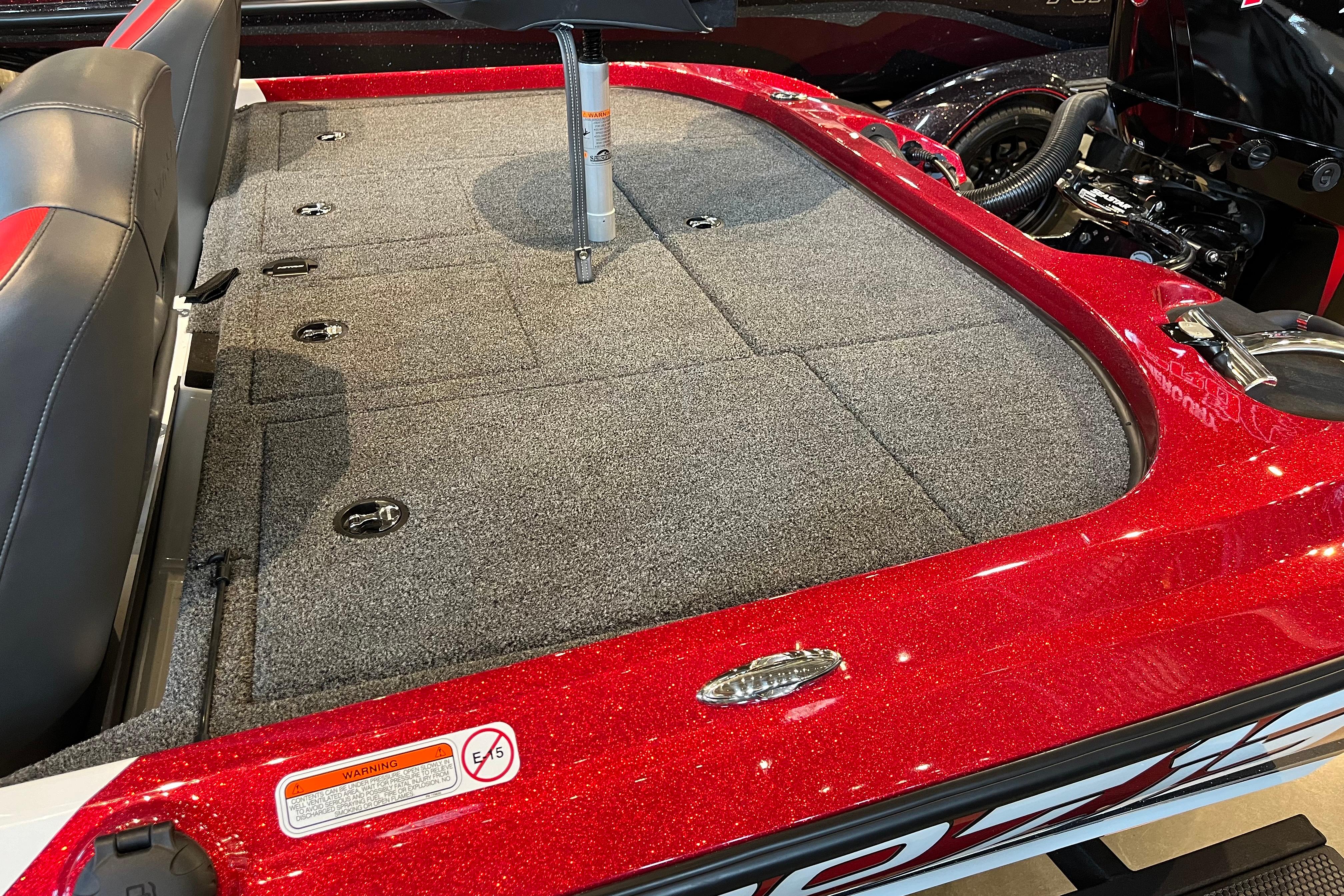 2025 Nitro Z19 boat interior with red accents and carpeted deck.