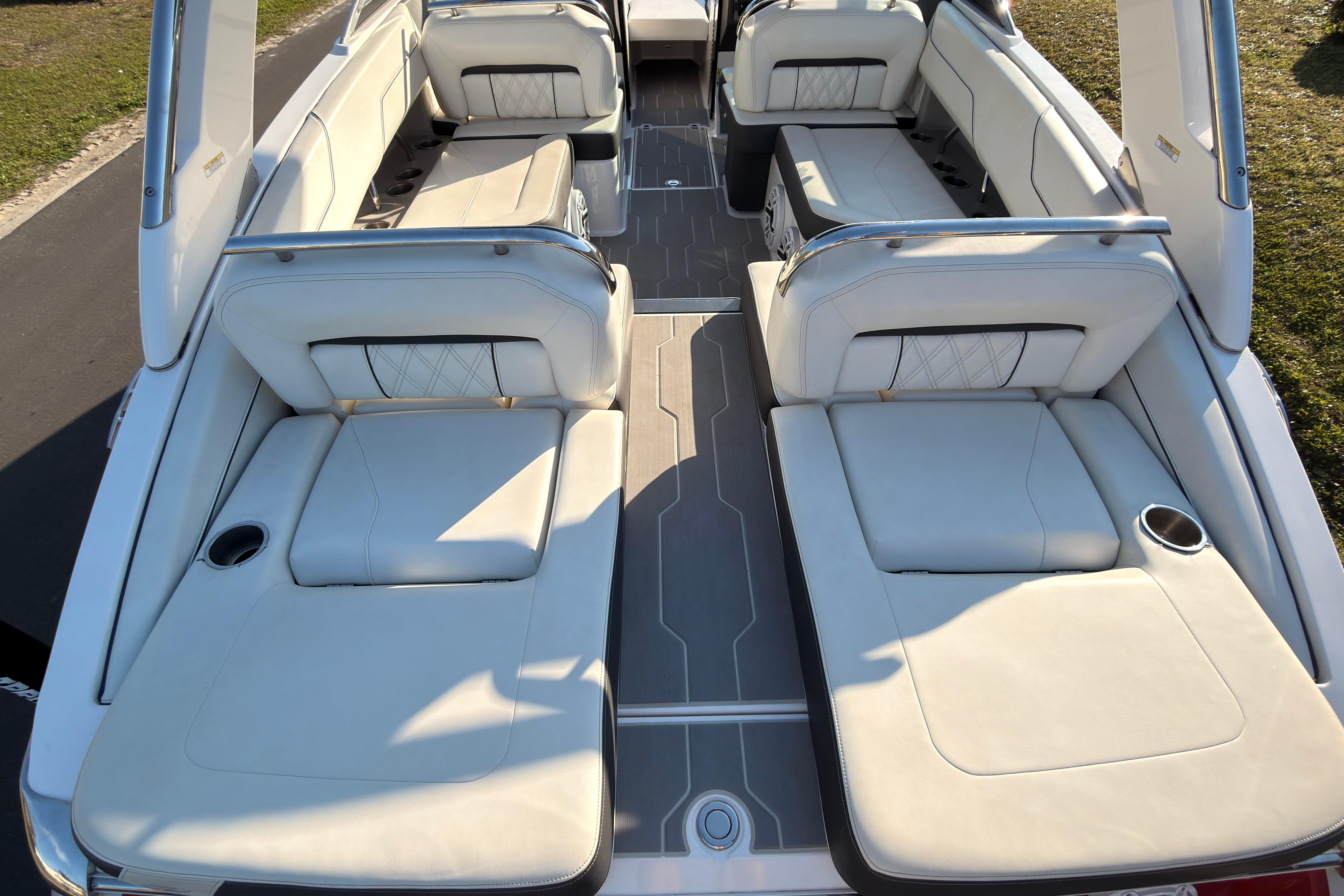 2019 Regal LS4 boat interior with luxurious white seating and cup holders.