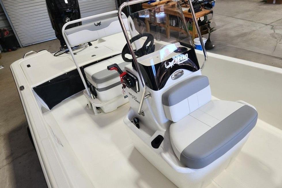 2026 Mako Pro Skiff 17 CC boat interior with steering console and seating.