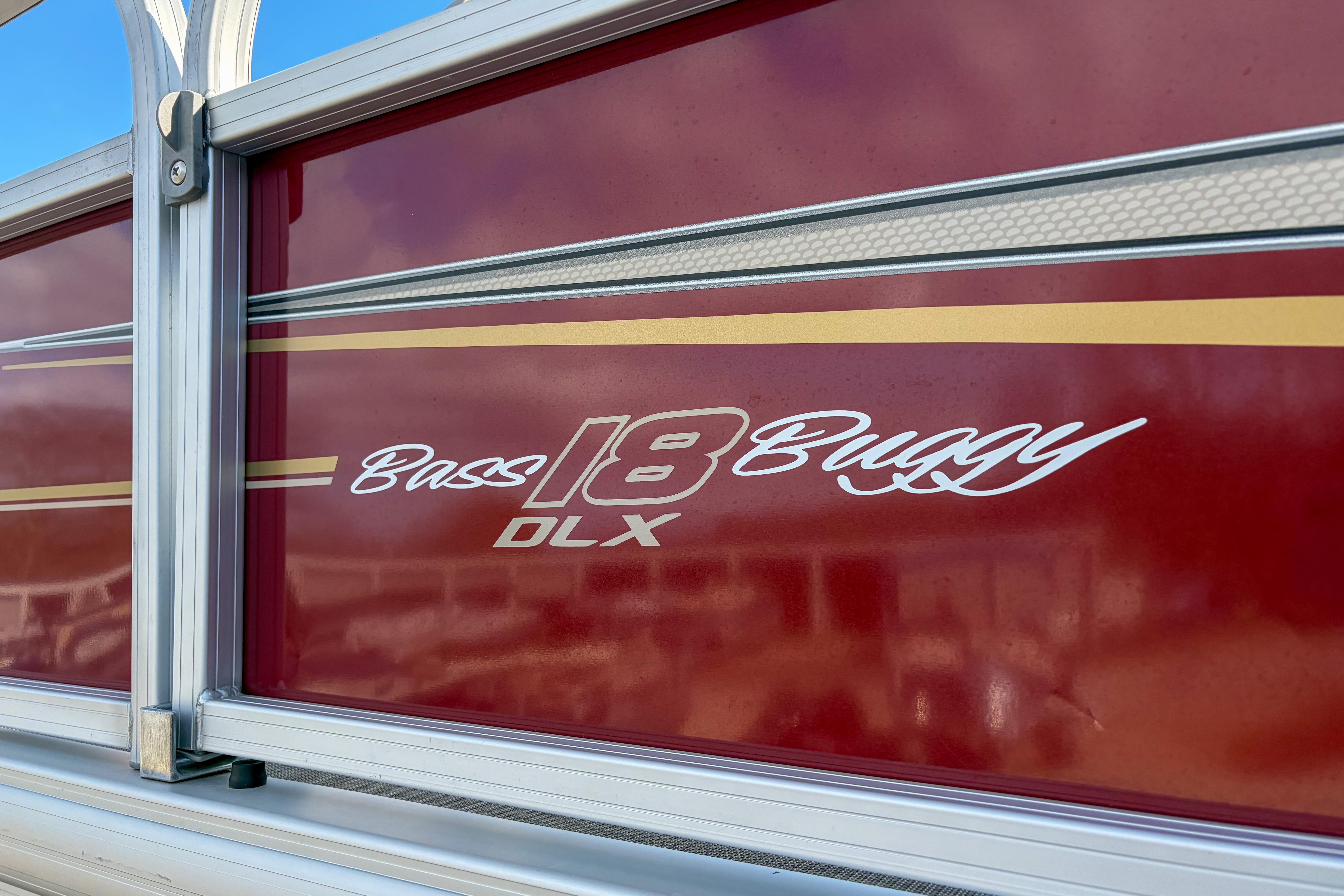 2024 Sun Tracker Bass Buggy 18 DLX, red exterior with logo detail.