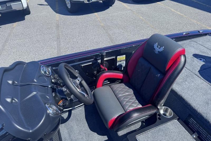 2026 Phoenix 819 ZXL boat interior with steering wheel and cushioned seat.