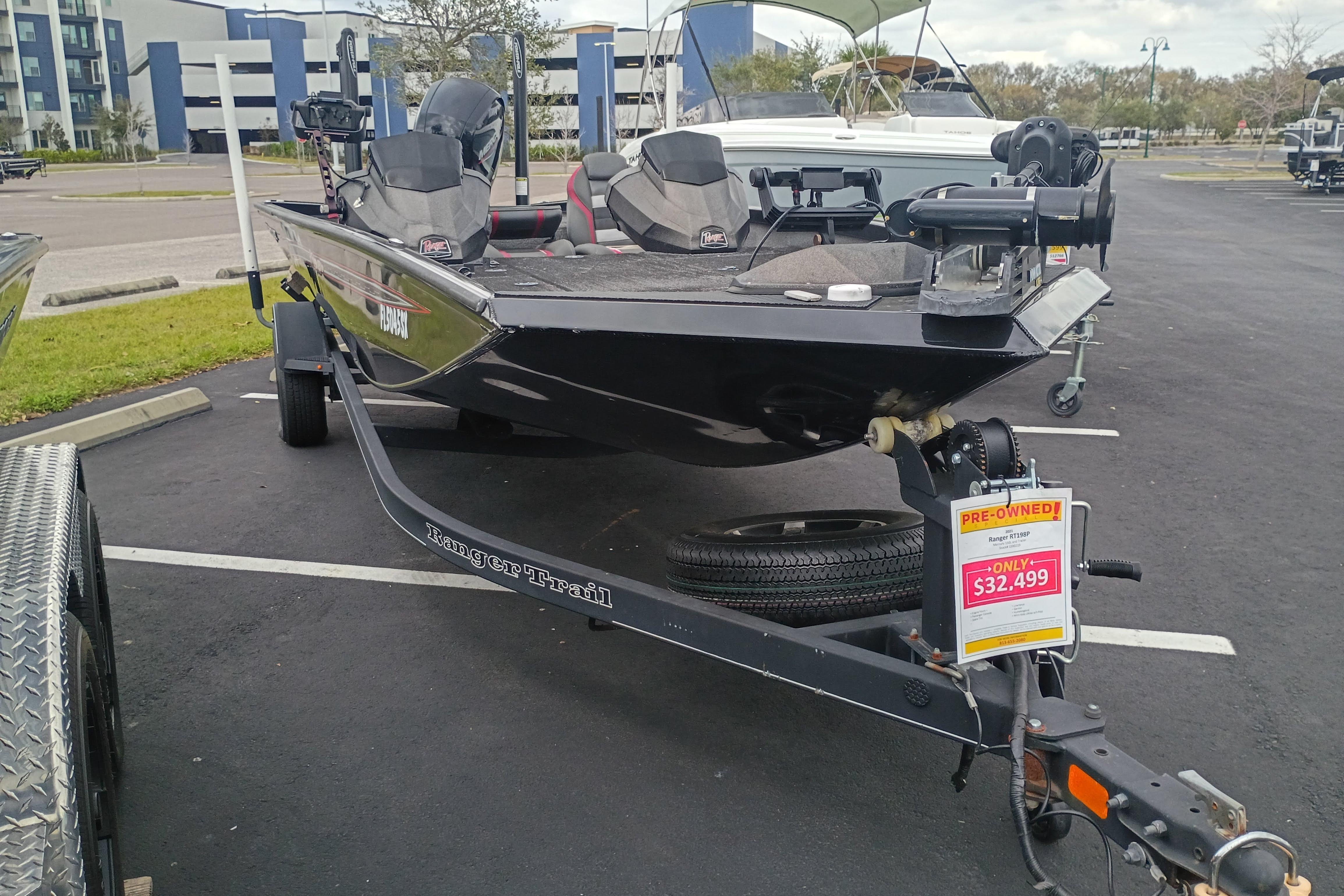2021 Ranger RT198P boat for sale, pre-owned, priced at $32,499, parked in a lot.