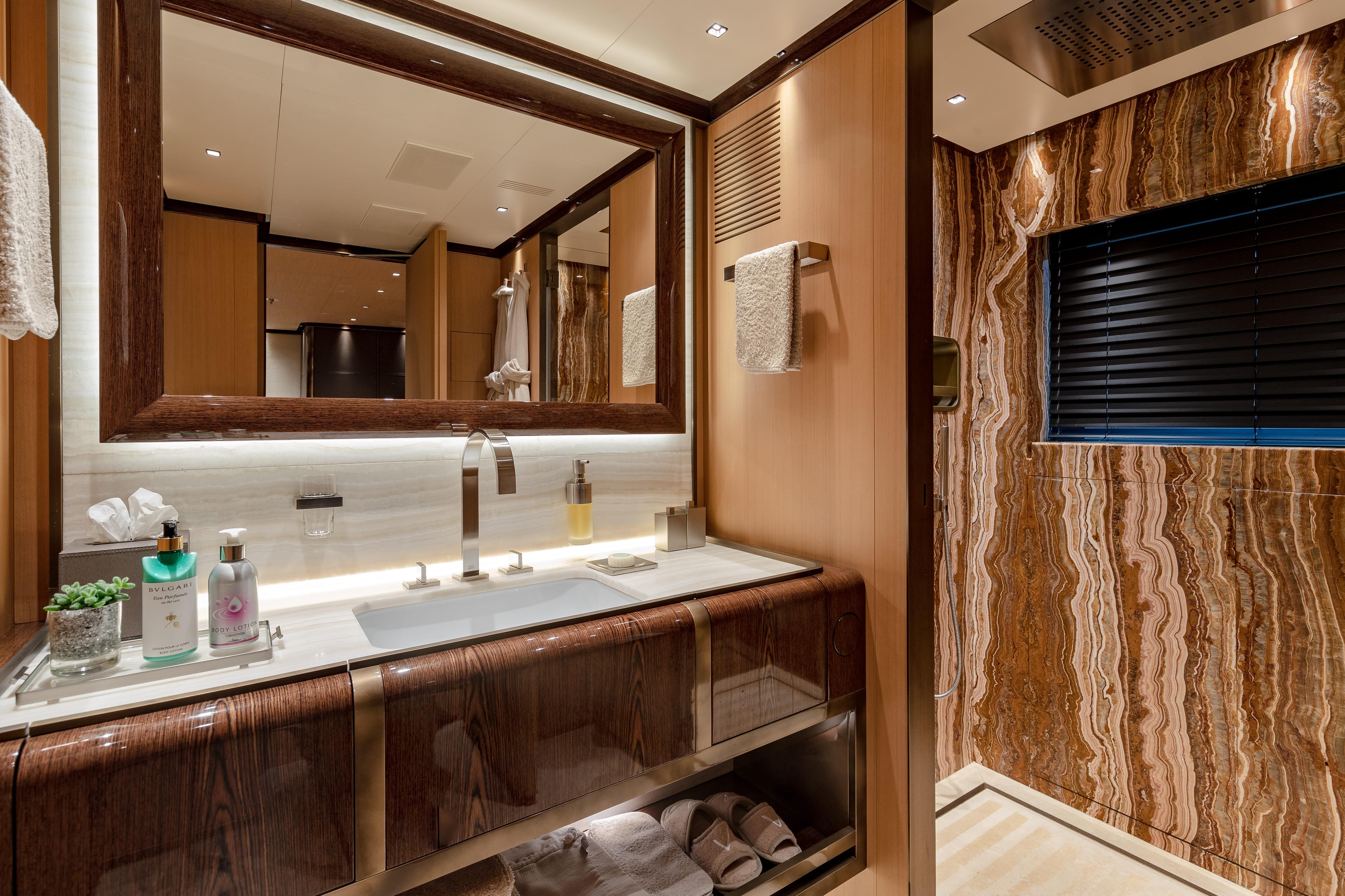 Luxurious bathroom in 2017 Tankoa S501 yacht with elegant wood and marble finishes.
