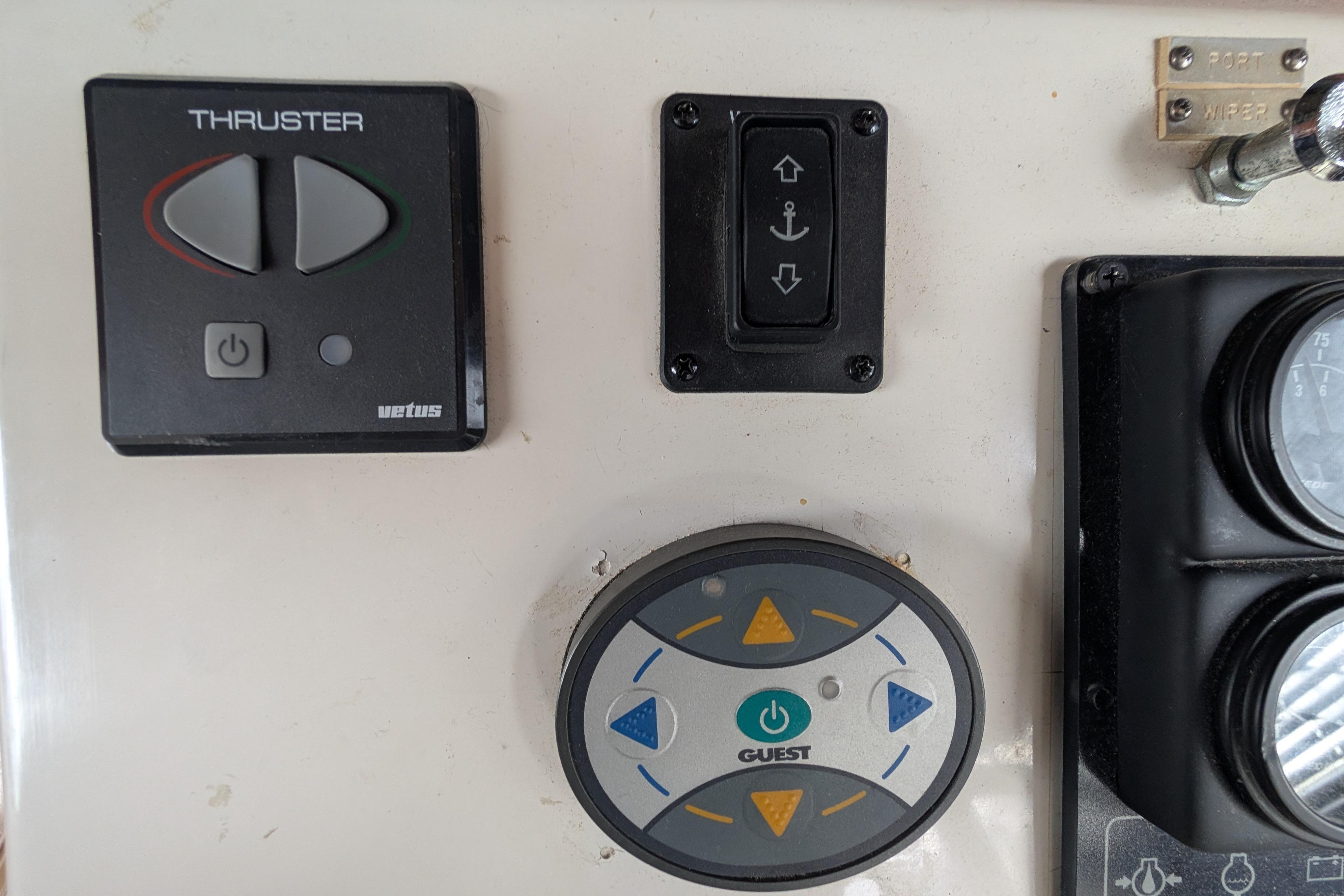 Control panel of a 1998 Markley 46 boat featuring thruster and anchor switches.