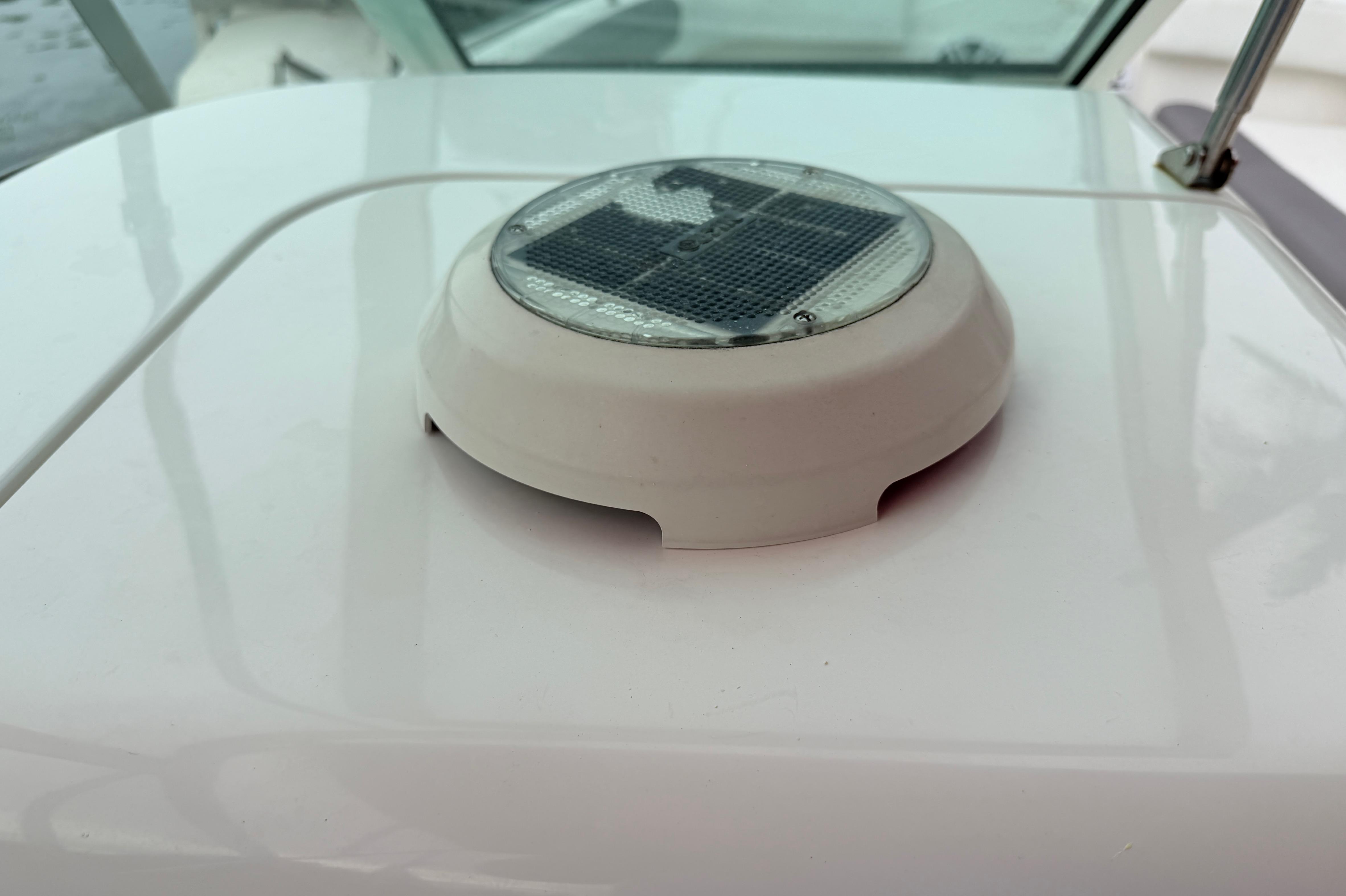 Solar-powered light on 2019 World Cat 230 DC boat deck.