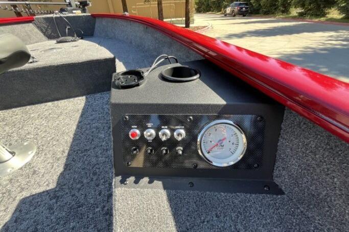2025 Tracker Super Guide V-16 T boat dashboard with controls and gauge.