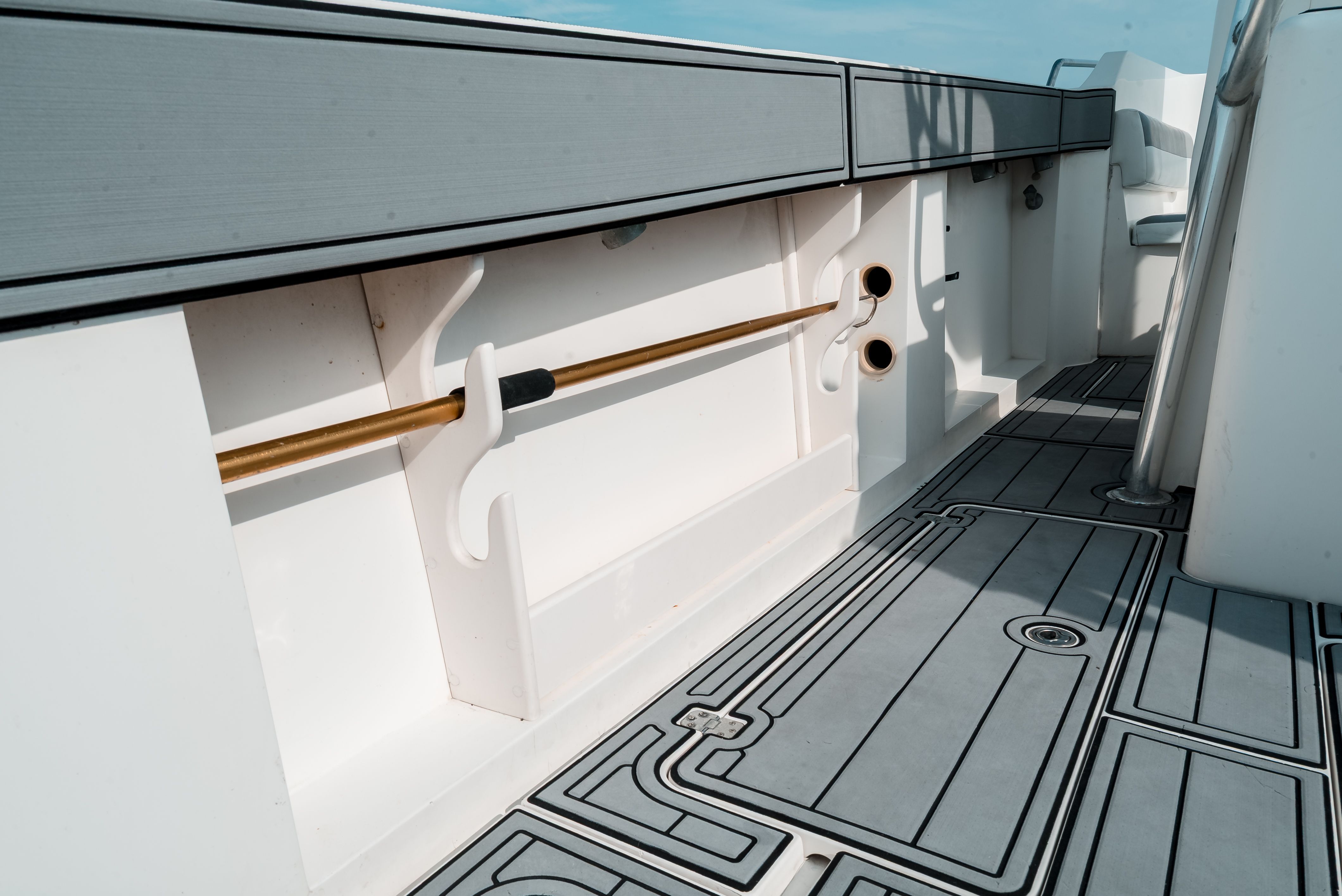 The image shows the deck of a 2006 Tempest Offshore 40 with gray flooring.
