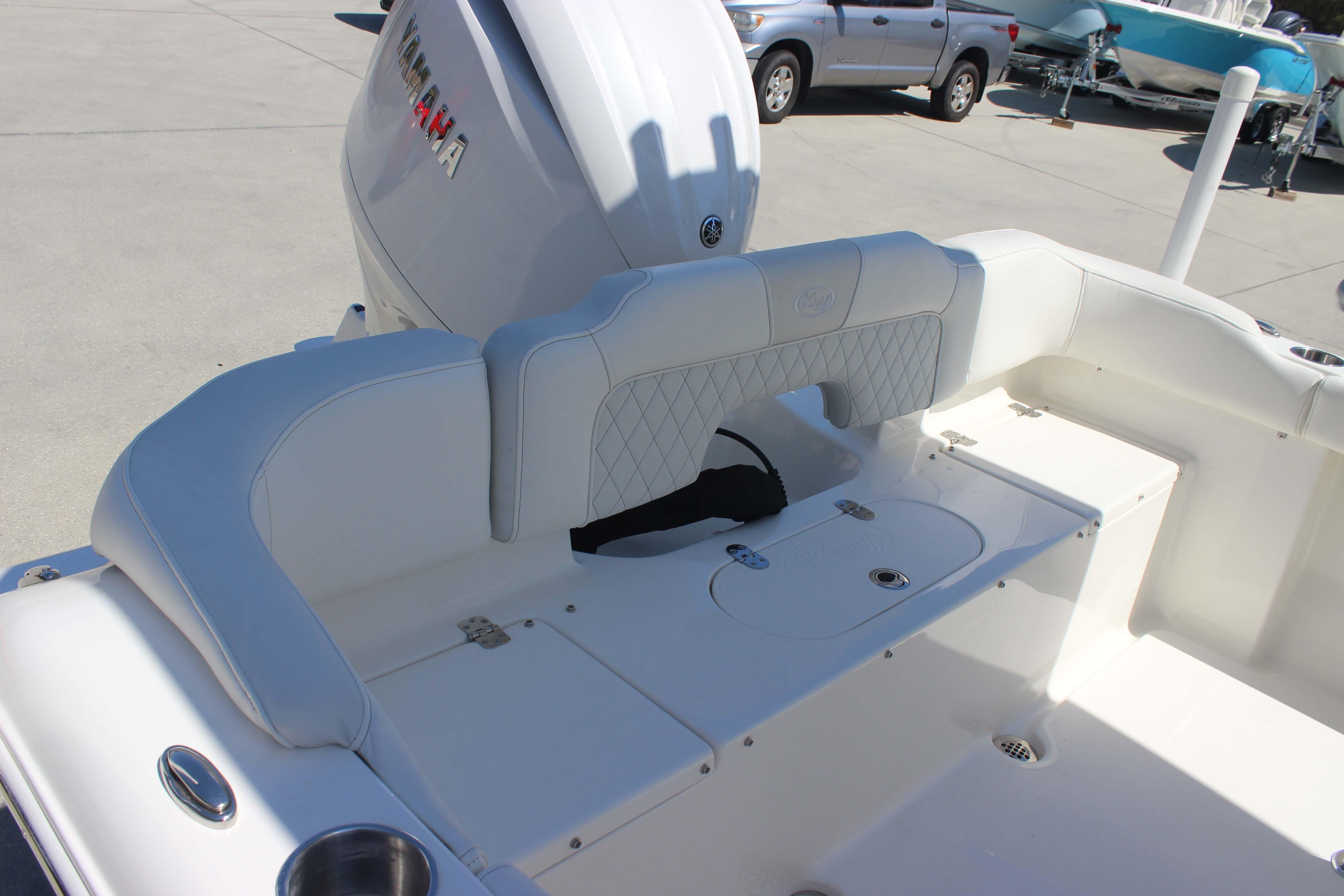 2026 Key West 203 FS boat interior with Yamaha engine, featuring white cushioned seating.
