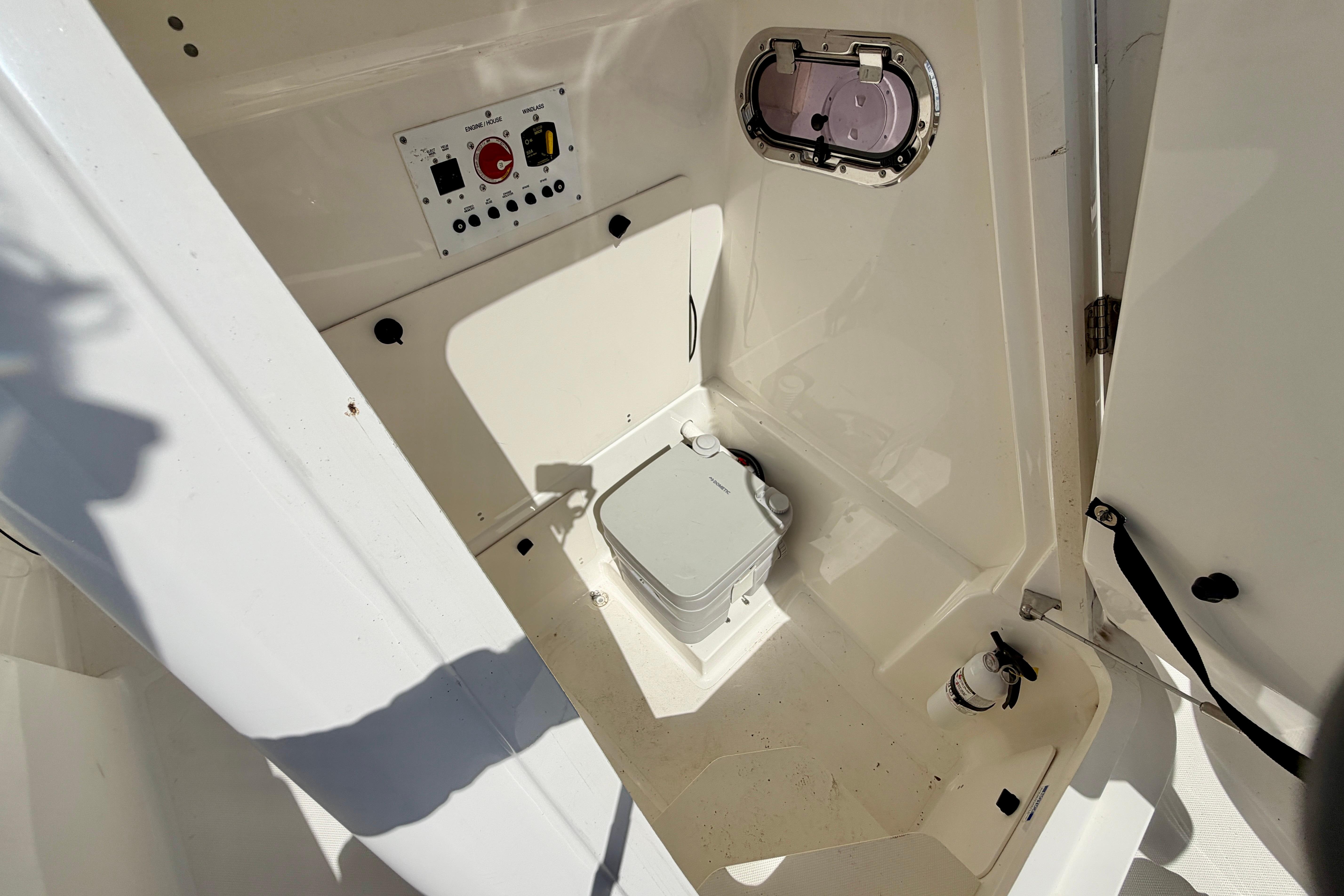 2020 Pursuit C 238 Center Console interior with control panel and storage area.