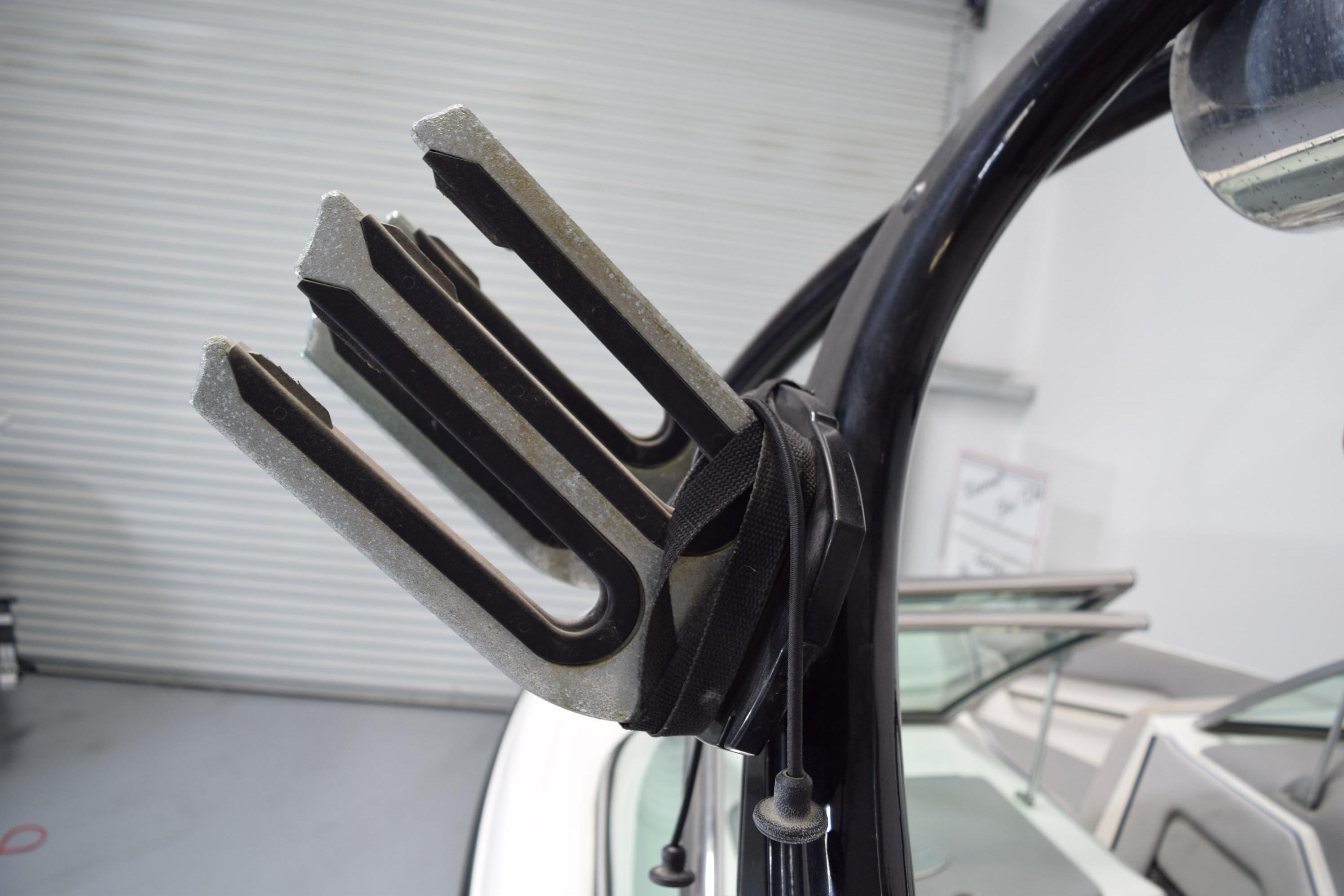 Wakeboard rack on a 2007 Centurion SV 240 boat, featuring a sleek black design.