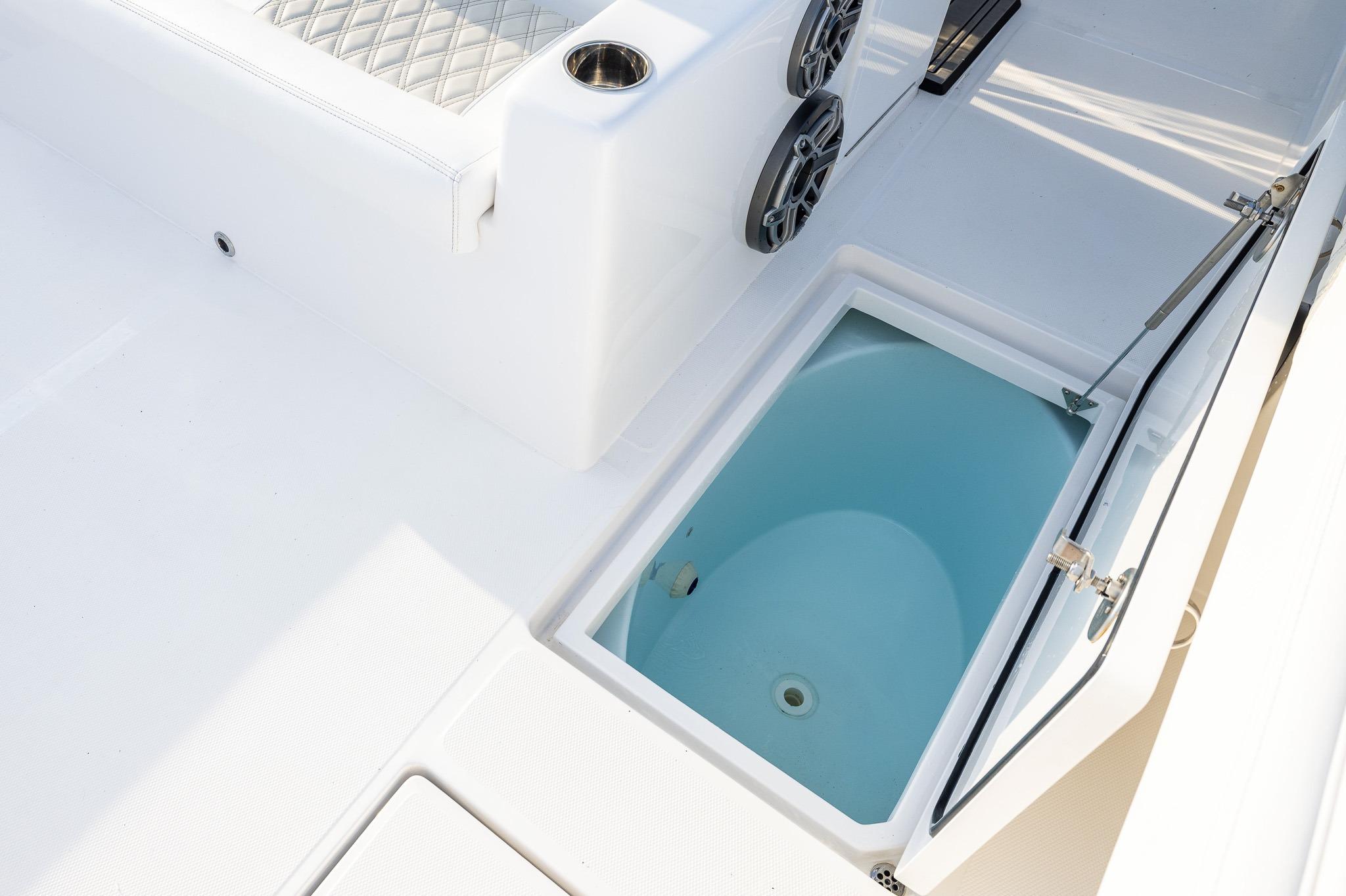 2026 Front Runner 37 Catamaran interior with open storage compartment and seating area.