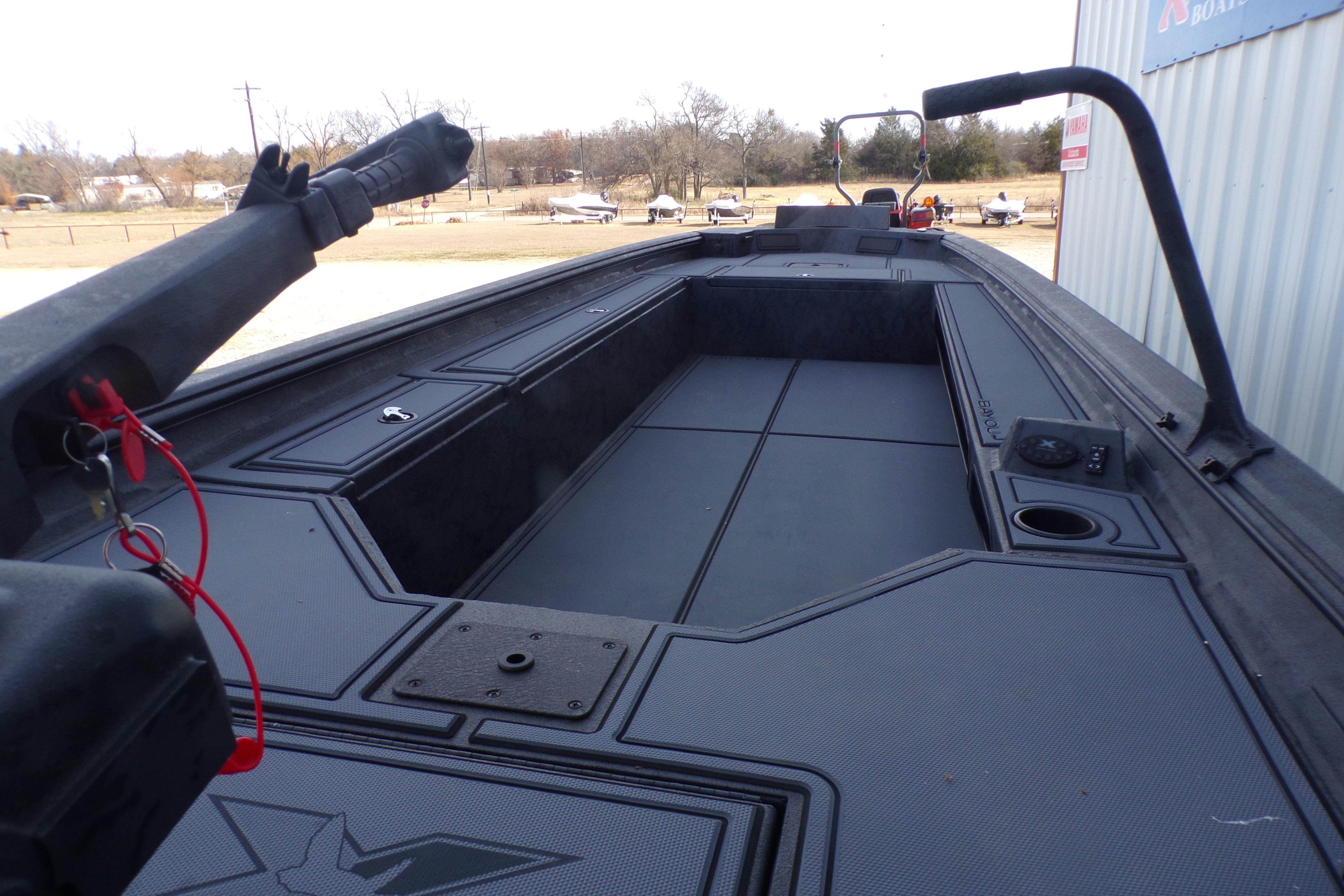 2026 Xpress Bayou 180 boat interior with spacious deck and storage compartments.