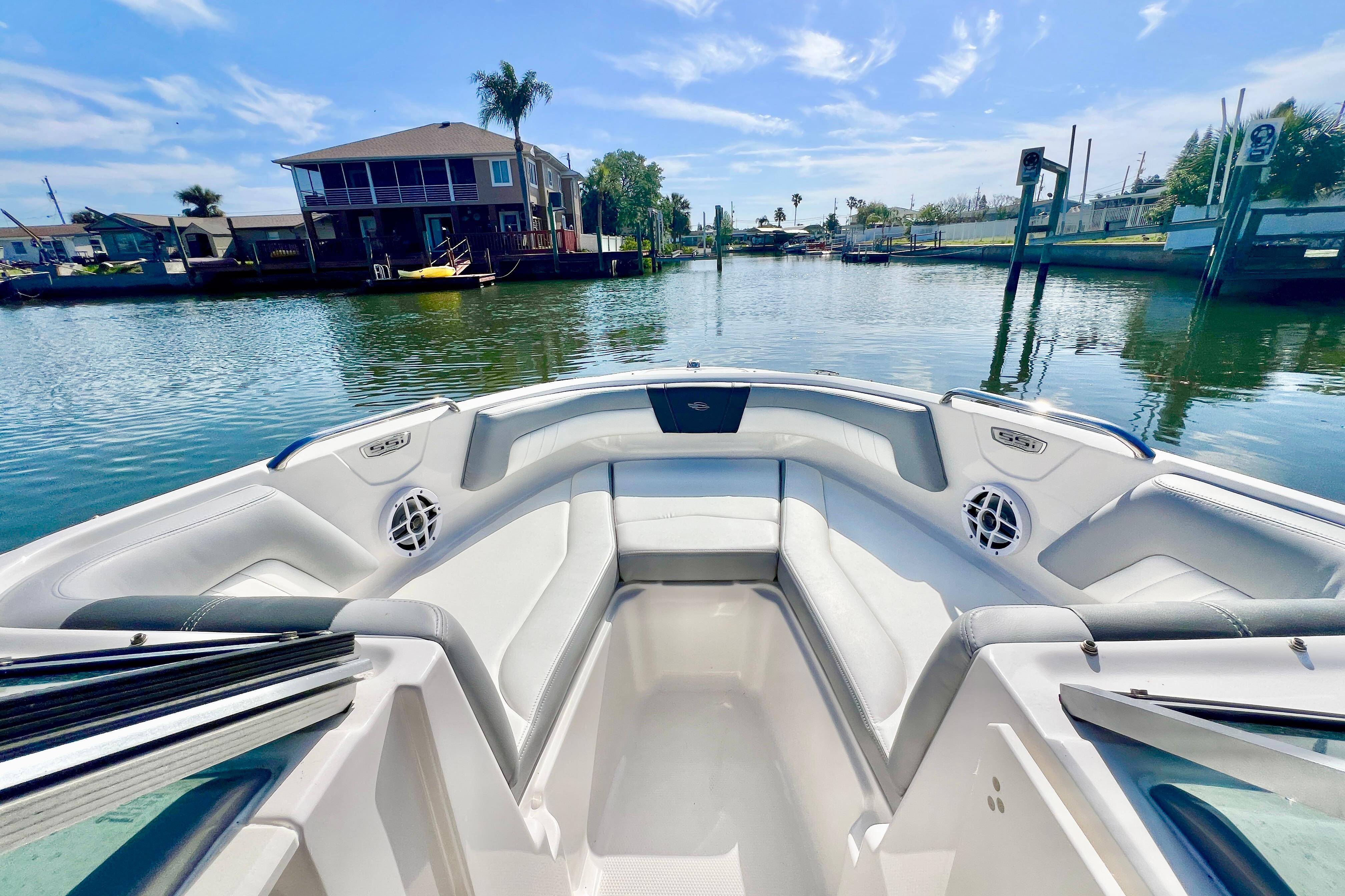 2023 Chaparral 21 SSi OB boat interior with waterfront view.