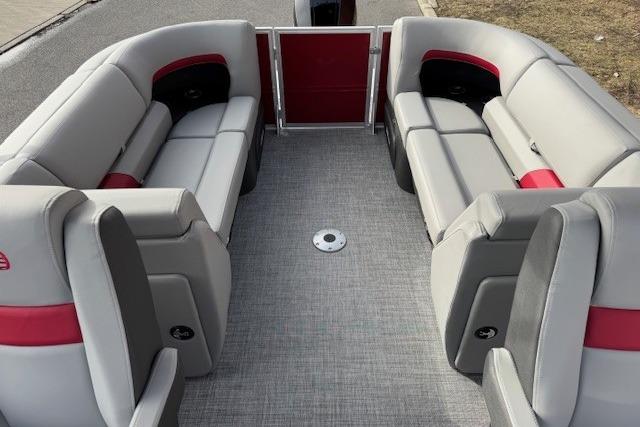 2026 Sun Tracker Party Barge 24 XP3 interior with gray and red seating.