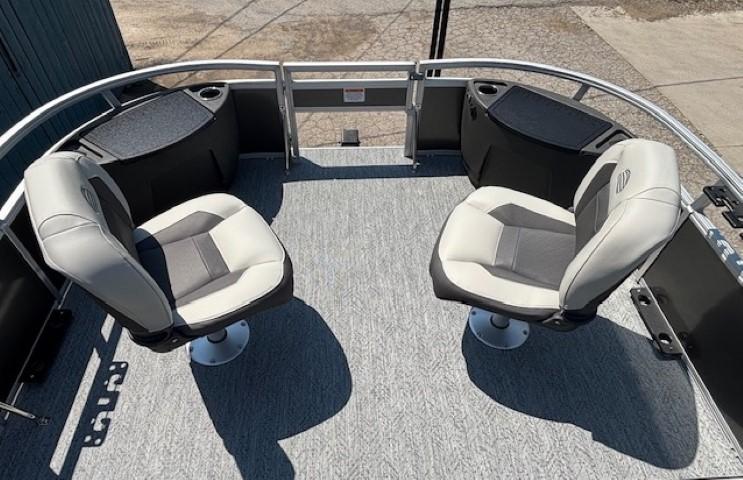 2026 Sun Tracker Bass Buggy 18 DLX pontoon boat with two swivel seats on deck.
