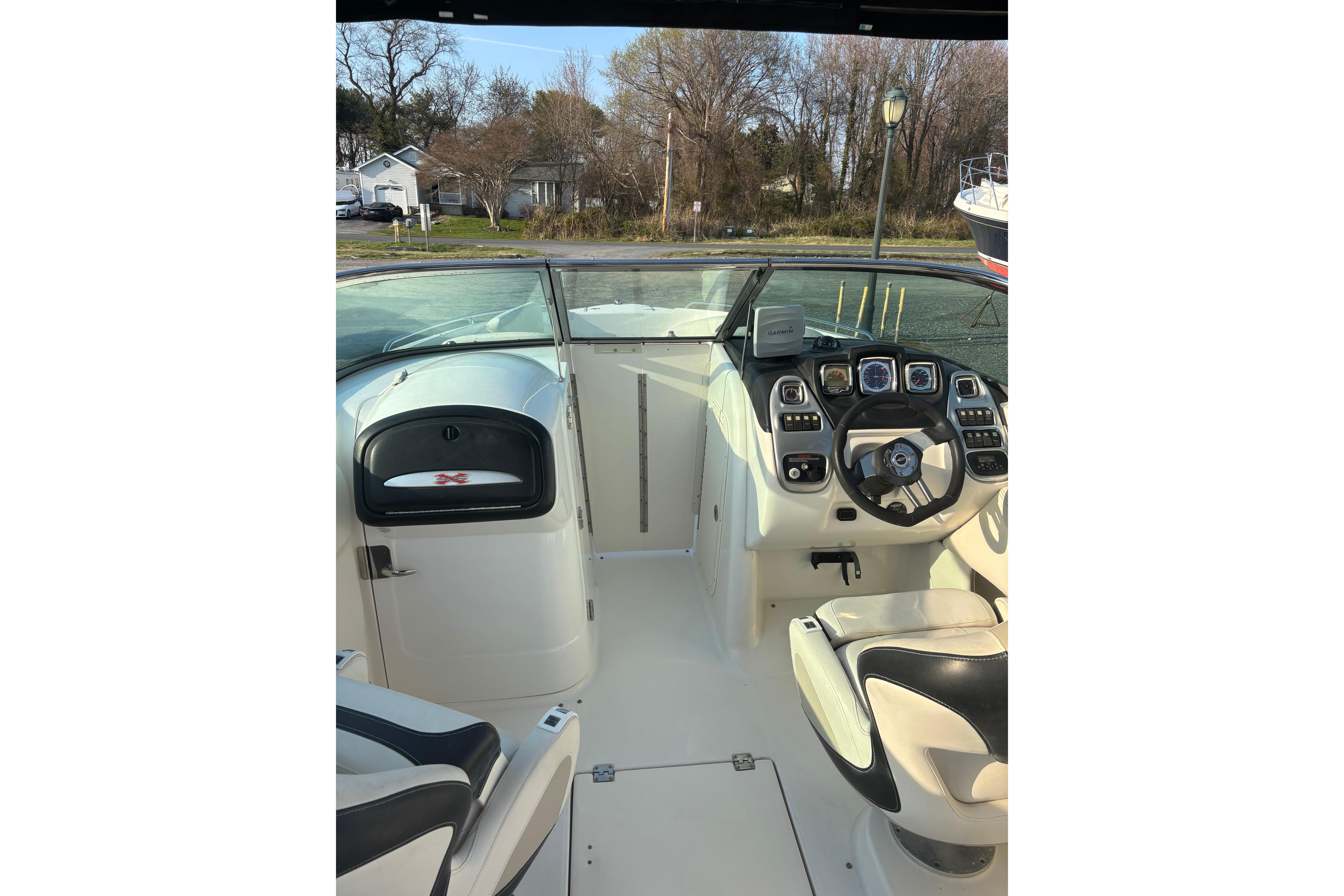 2012 Chaparral 267 SSX boat interior with steering wheel and dashboard controls.