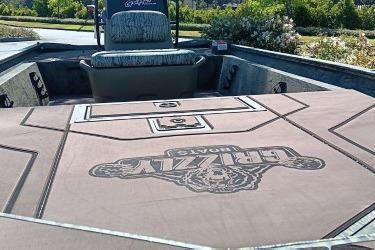 2026 Tracker Grizzly 1860 CC boat interior with branded deck and seating.