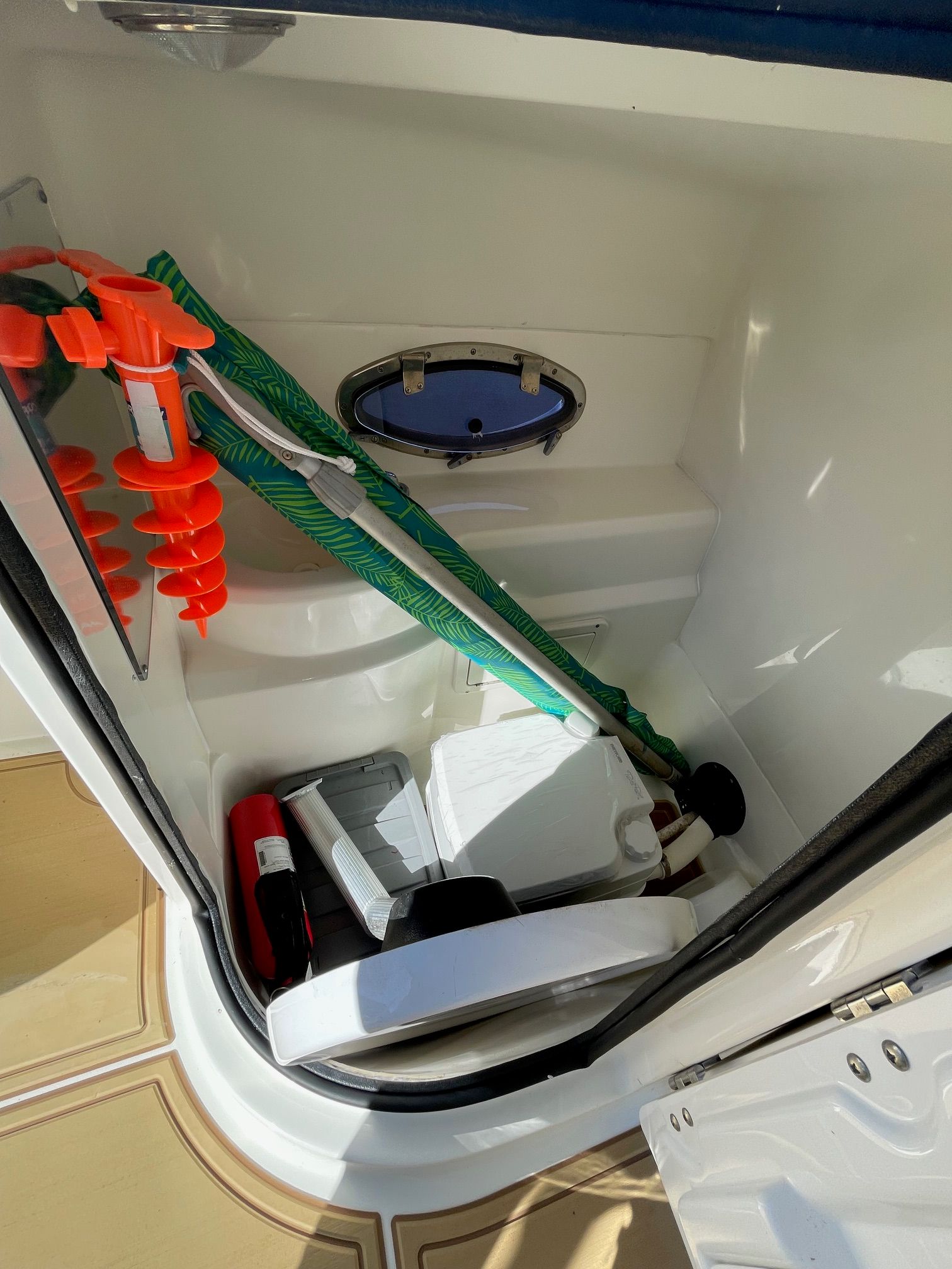 Boat storage compartment with equipment and accessories.