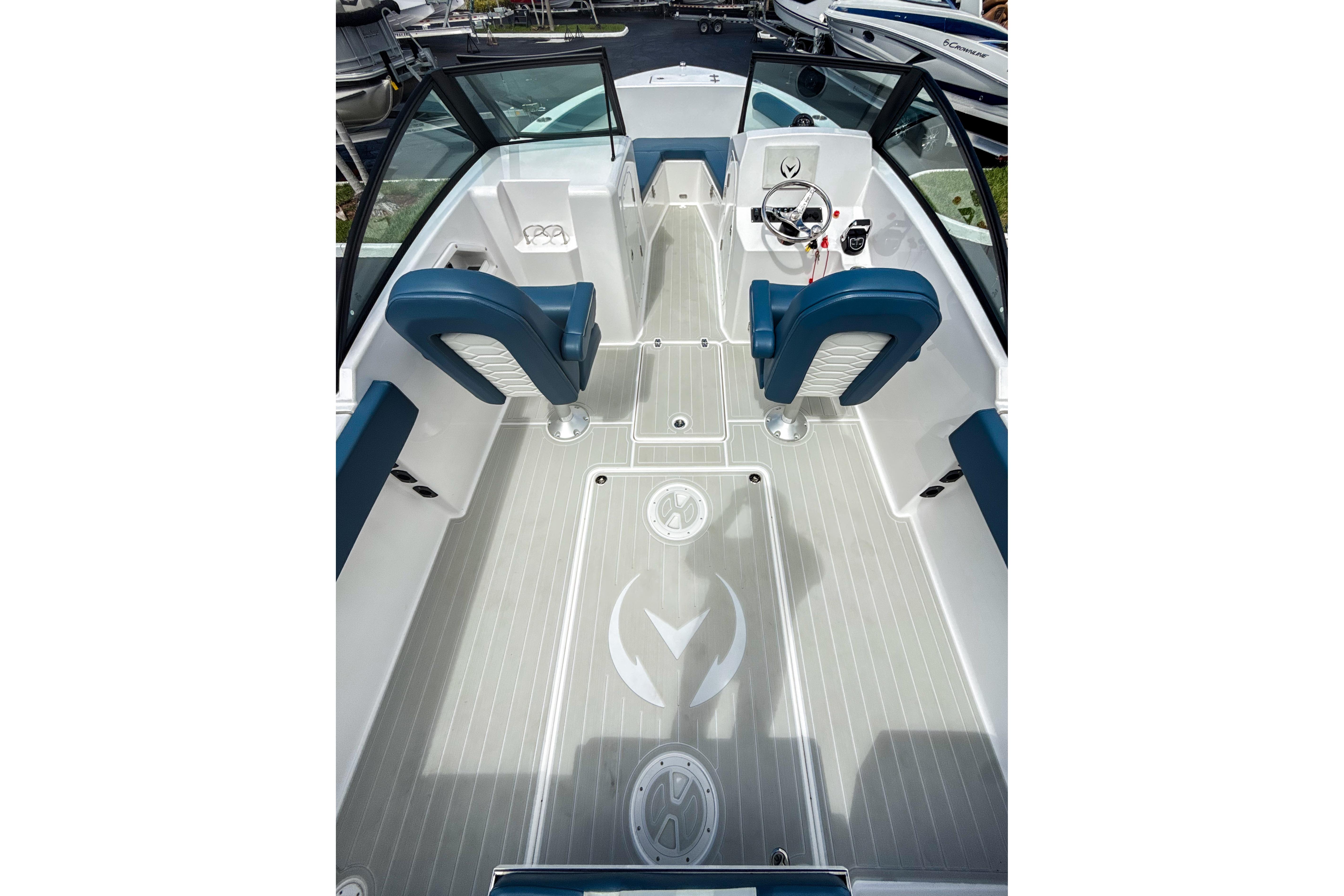 2024 Aquasport AS DC 22 boat interior with blue seating and modern steering console.