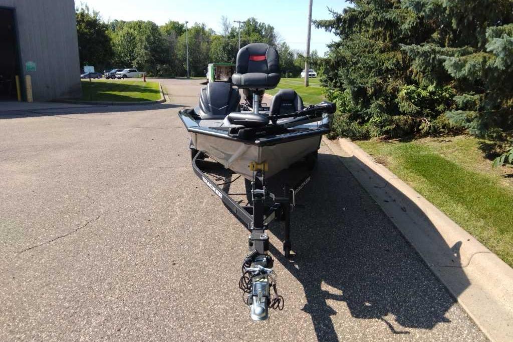 2026 Tracker Pro Team 190 boat on trailer, parked on a sunny street.