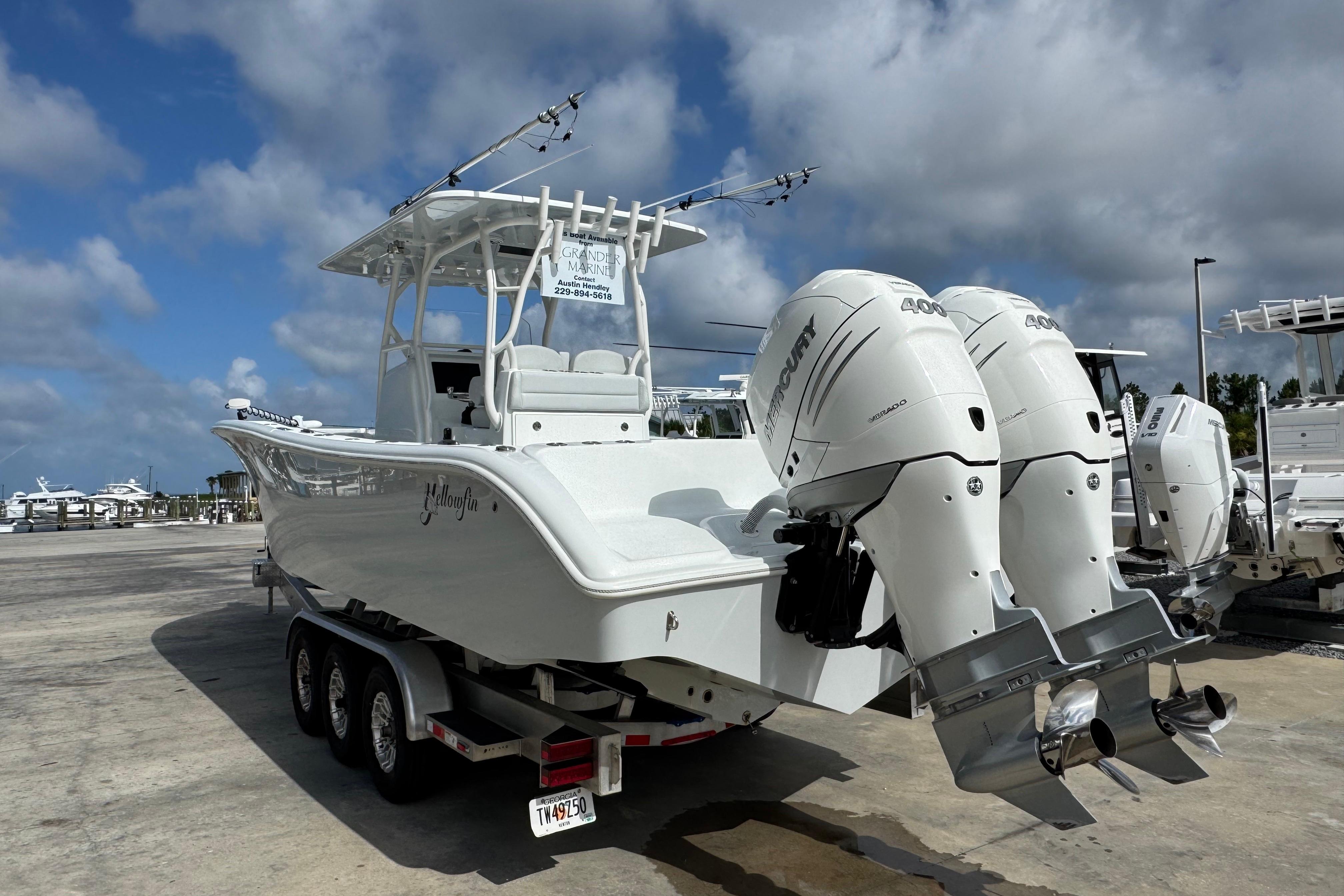 2022 Yellowfin 32 Offshore boat with twin Mercury 400 engines on a trailer.