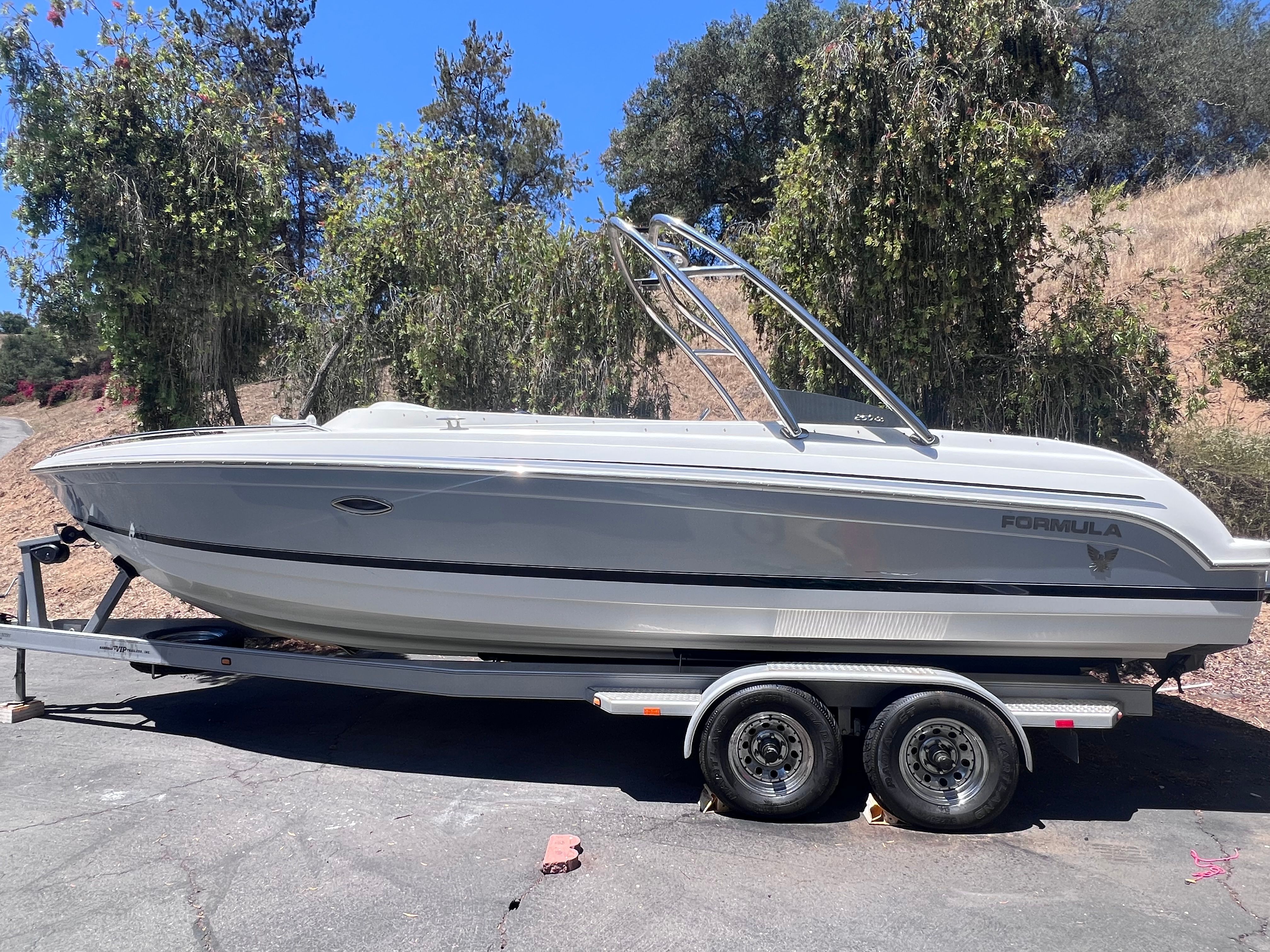 2006 Formula 260 Sun Sport boat on trailer outdoors.