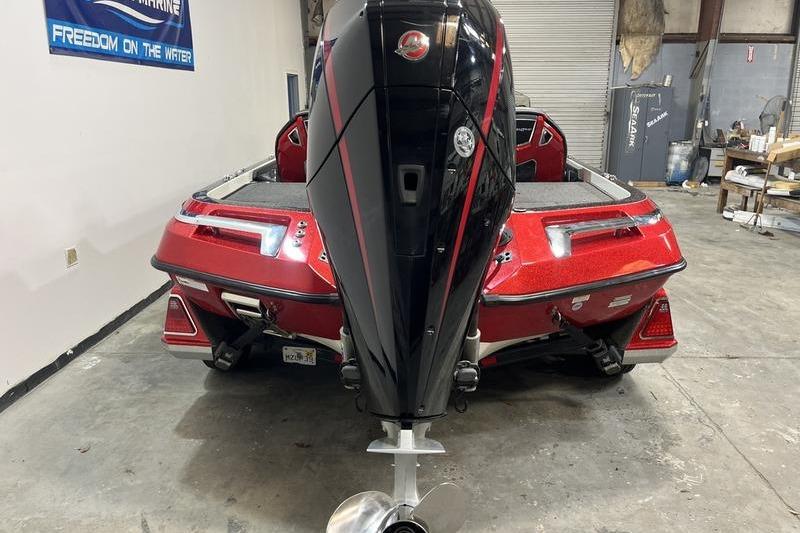 2022 Ranger Z520R boat with a powerful outboard motor in a garage setting.