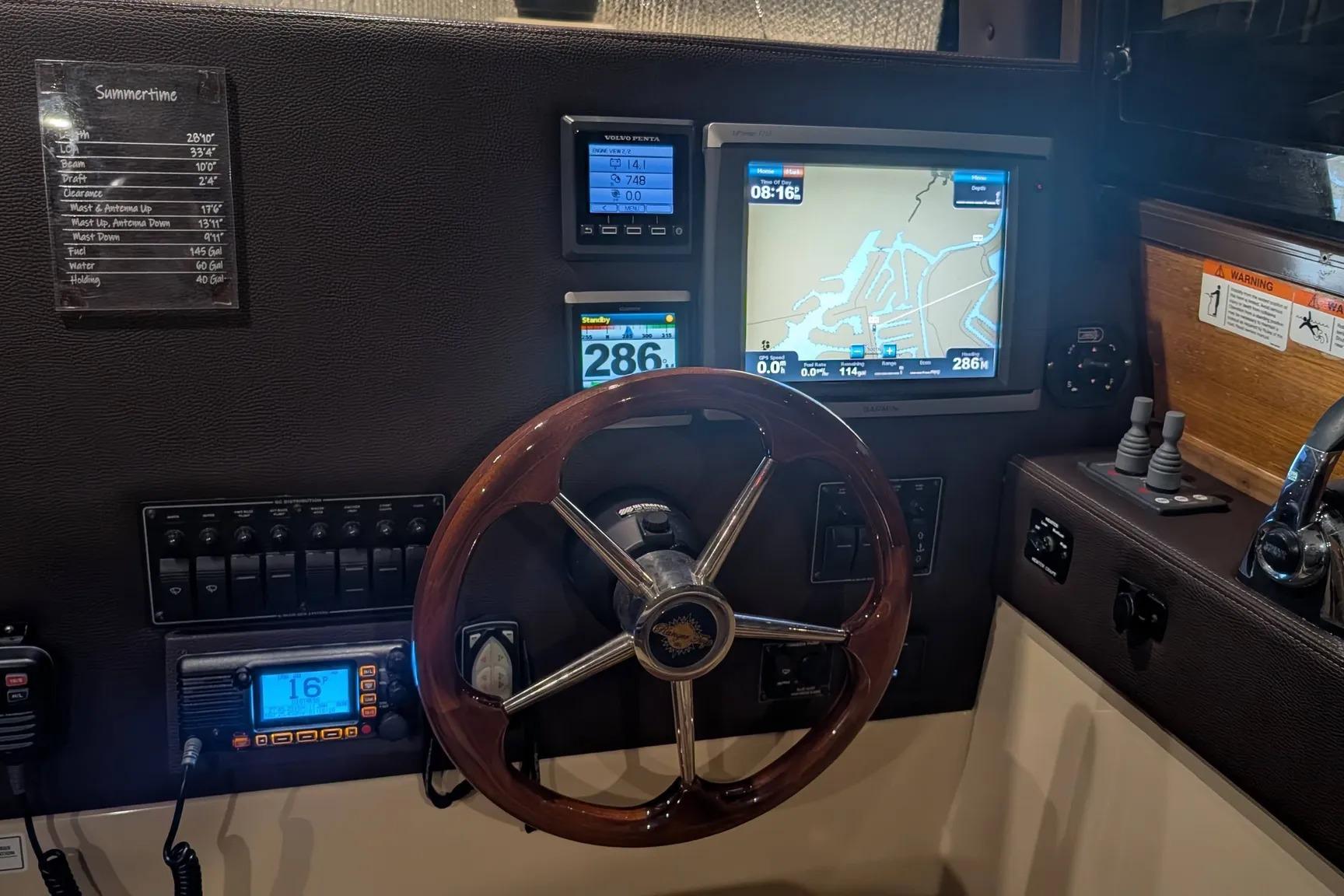 2015 Ranger Tugs R-29 S helm with navigation screens and controls.