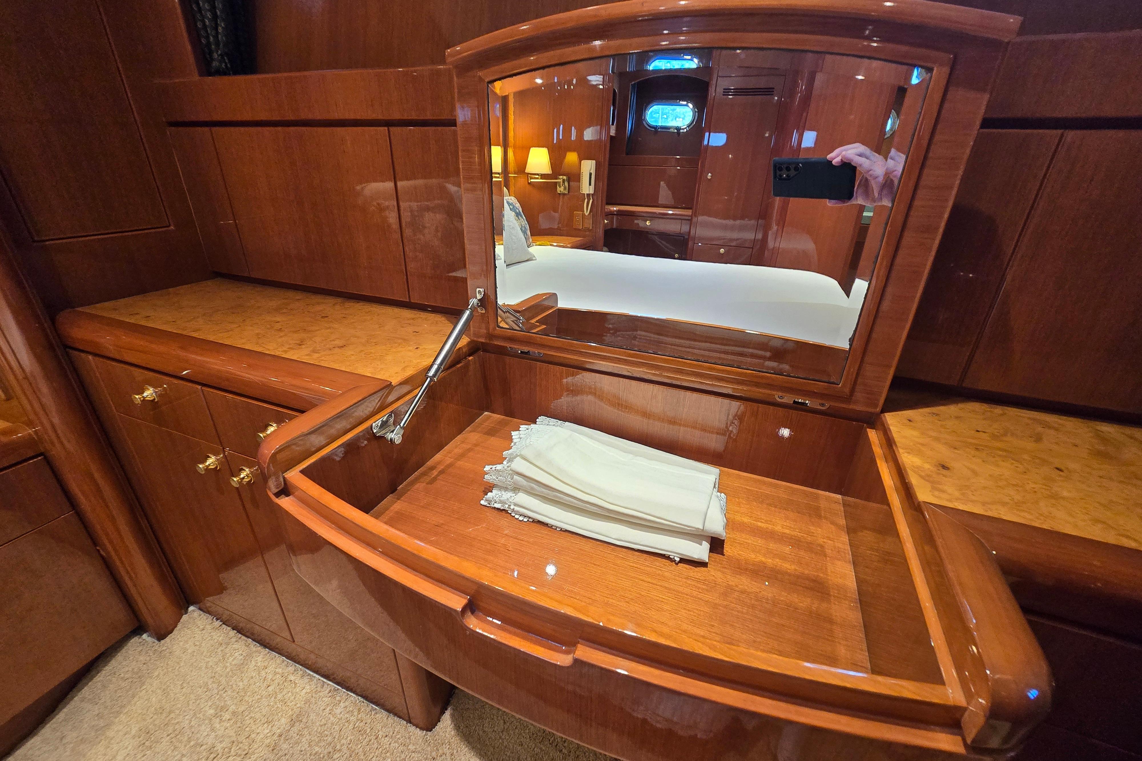 Luxurious wooden vanity with mirror in 2004 Grand Harbour 58 yacht interior.