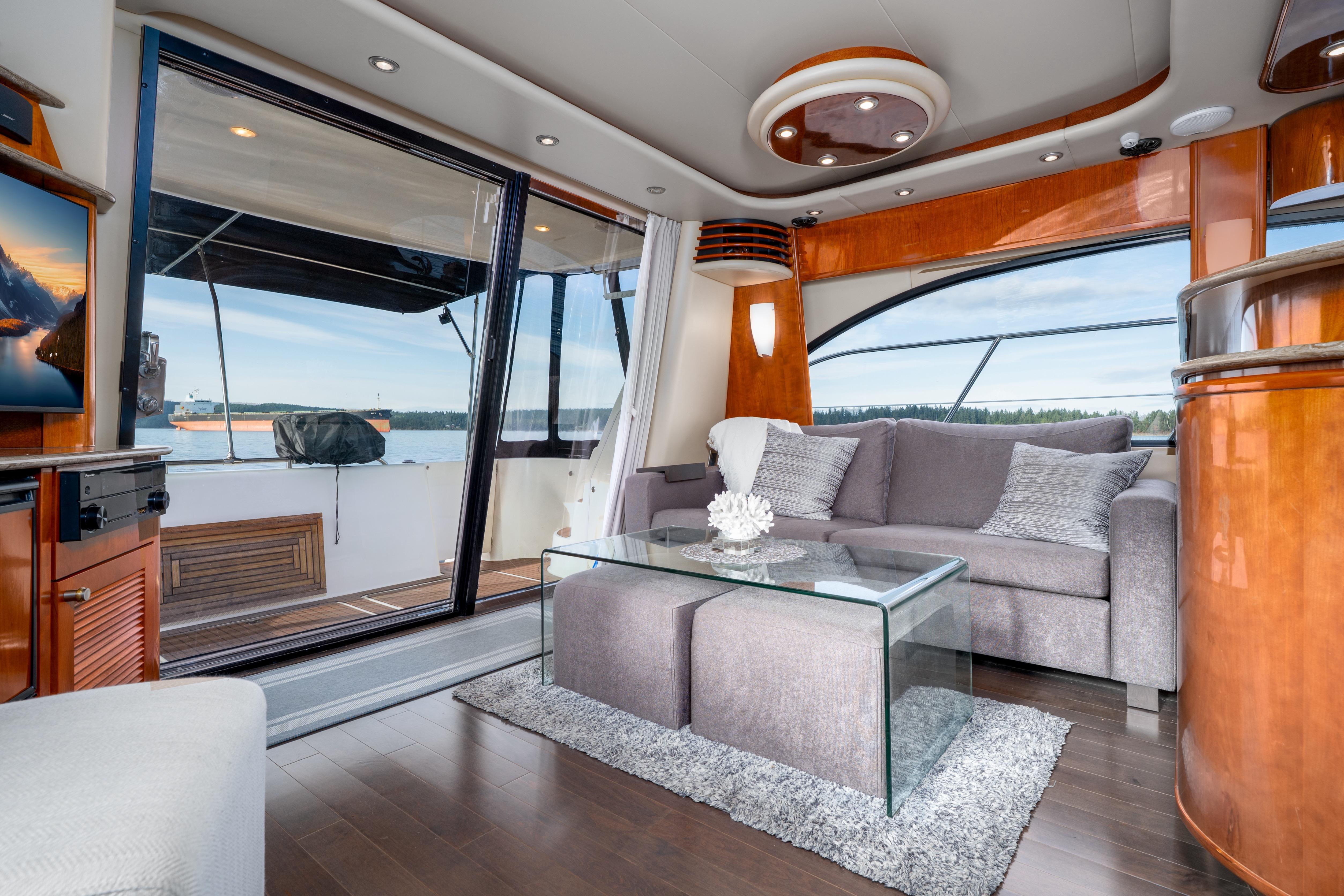 Luxurious interior of 2007 Meridian 580 Pilothouse yacht with modern furnishings and scenic view.