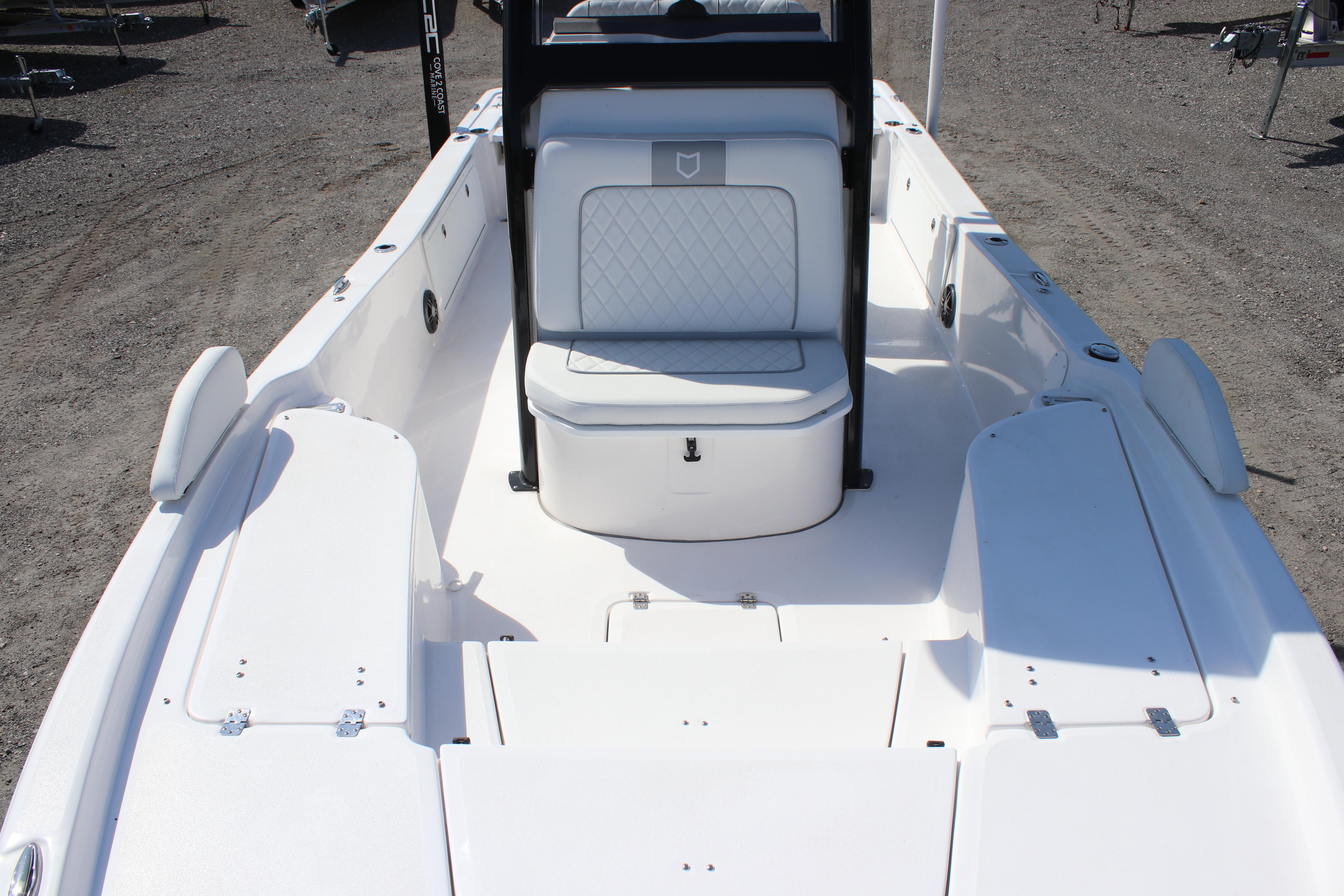 2025 Sea Fox 251 Bay Fox boat interior with white seating and storage compartments.