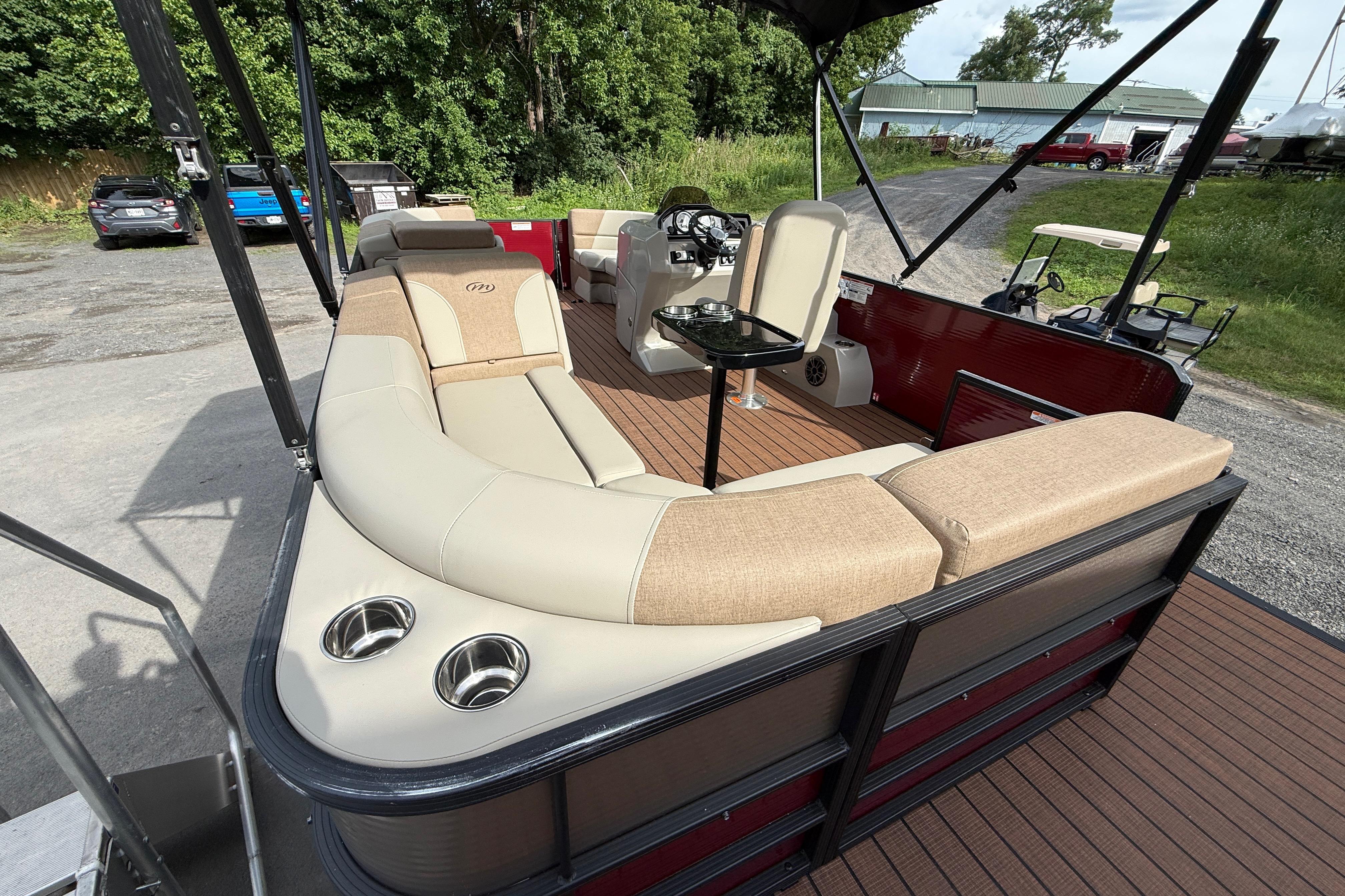 2027 Manitou 21 Aurora LE pontoon boat with spacious seating and modern amenities.