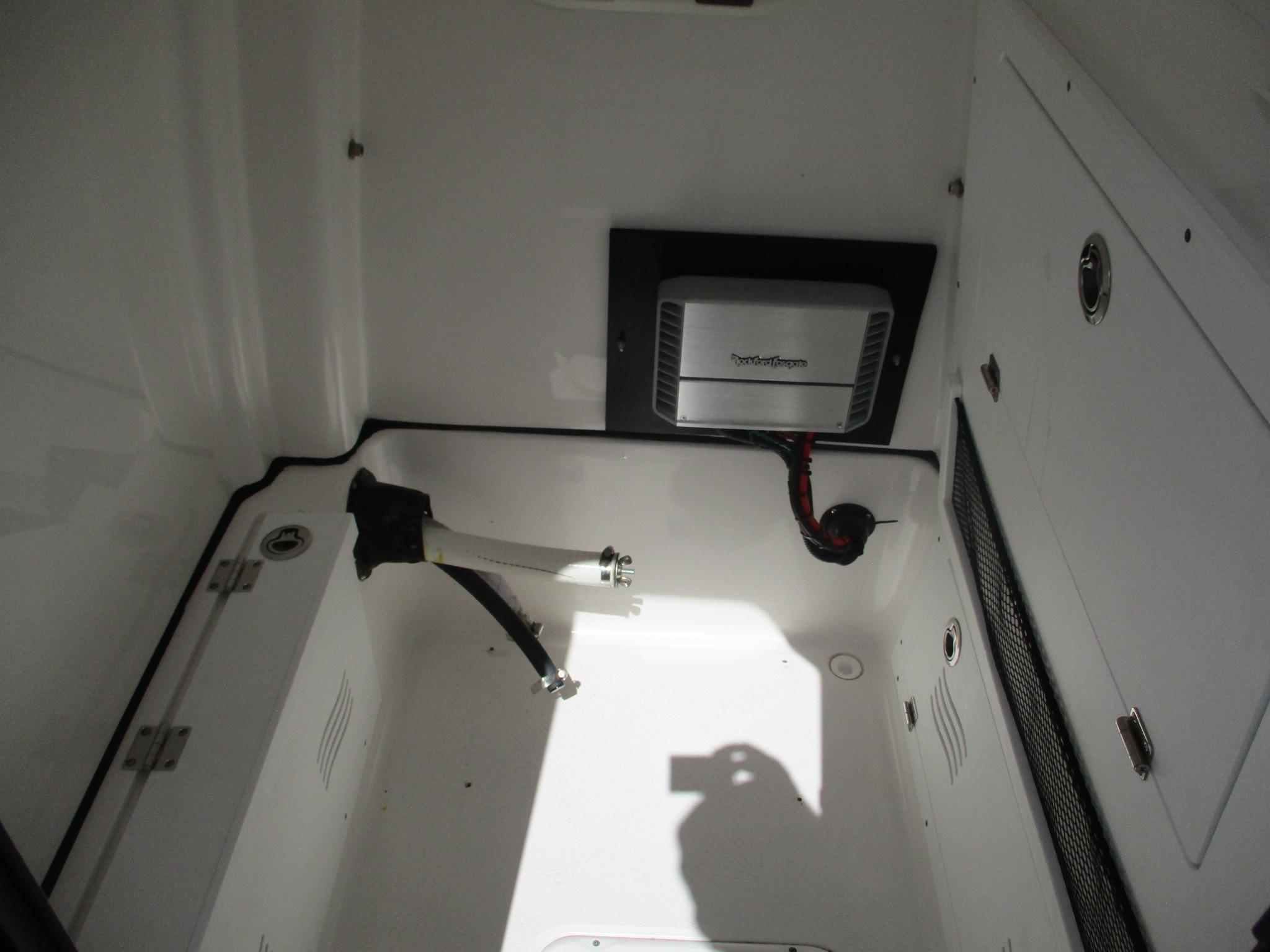 Interior view of 2024 Blue Wave 2800 Makaira boat compartment with installed equipment.