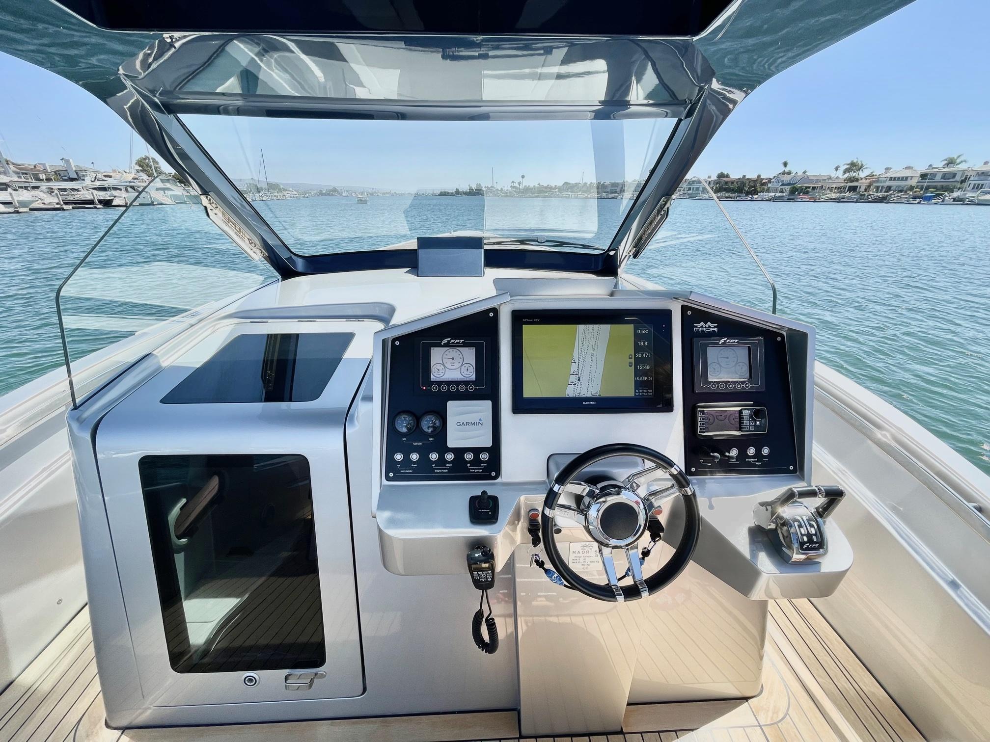 2017 Maori 50 boat cockpit with modern navigation system and steering wheel.