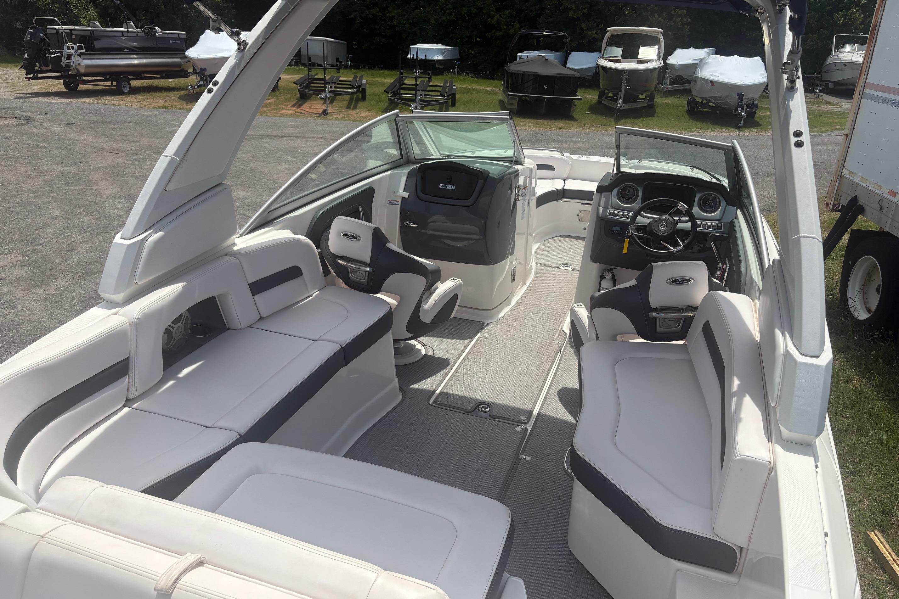 2019 Chaparral 264 Sunesta boat interior with spacious seating and modern dashboard.