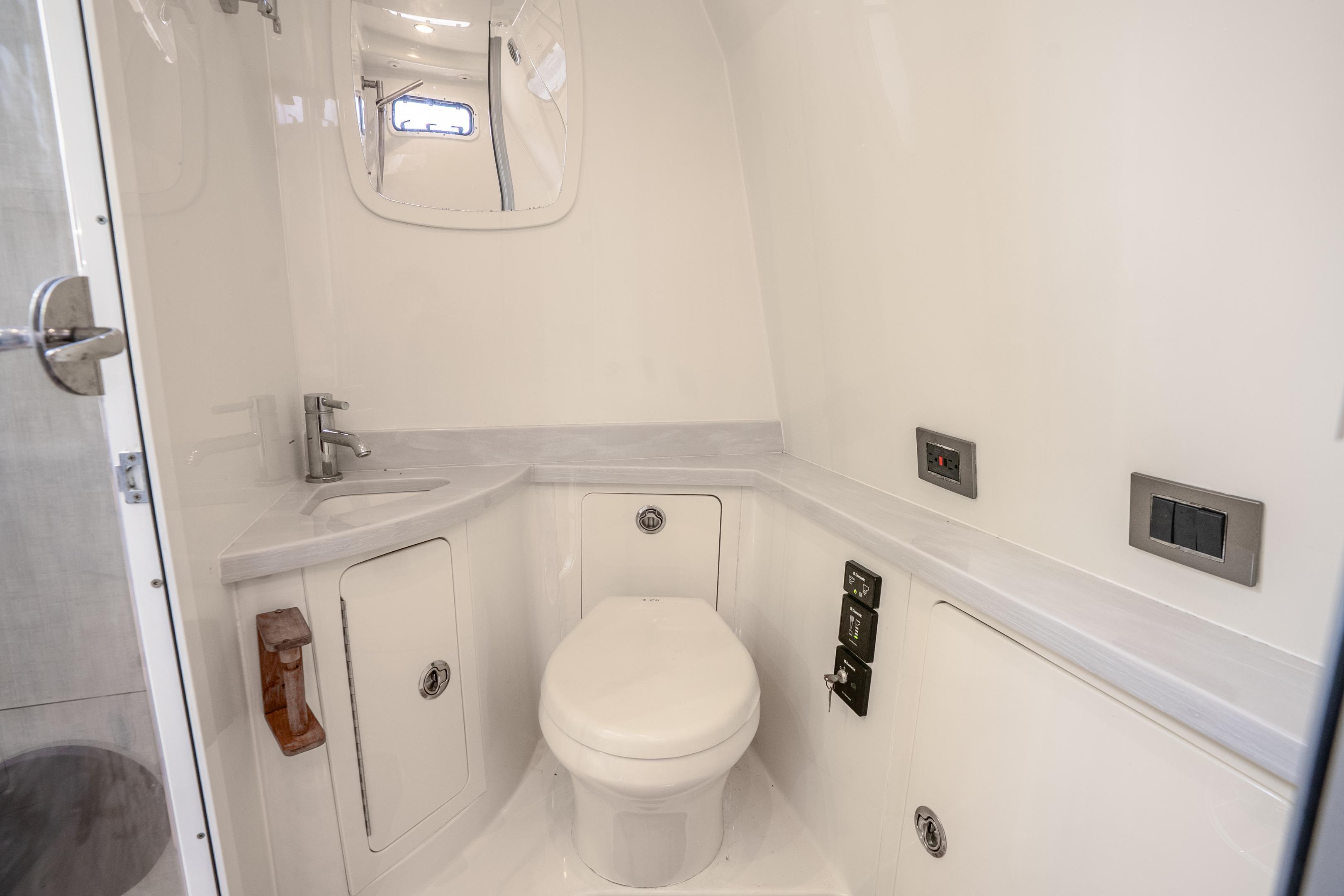 Luxurious bathroom interior of 2017 HCB 53 Suenos yacht, featuring modern fixtures and sleek design.