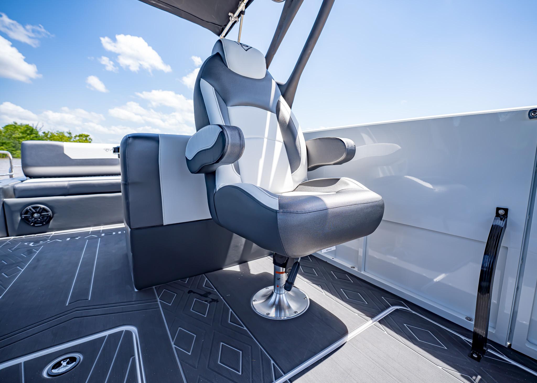 Captain's chair on 2025 Paradigm Damascus 266 Surf boat, under clear blue sky.