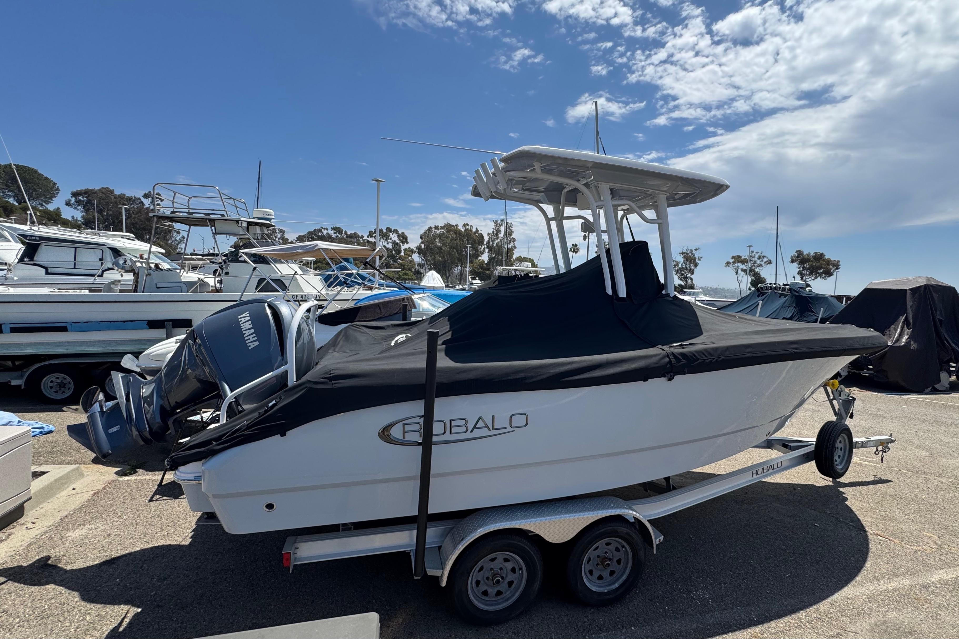 2022 Robalo R230 Center Console boat on trailer, covered, with Yamaha engine.
