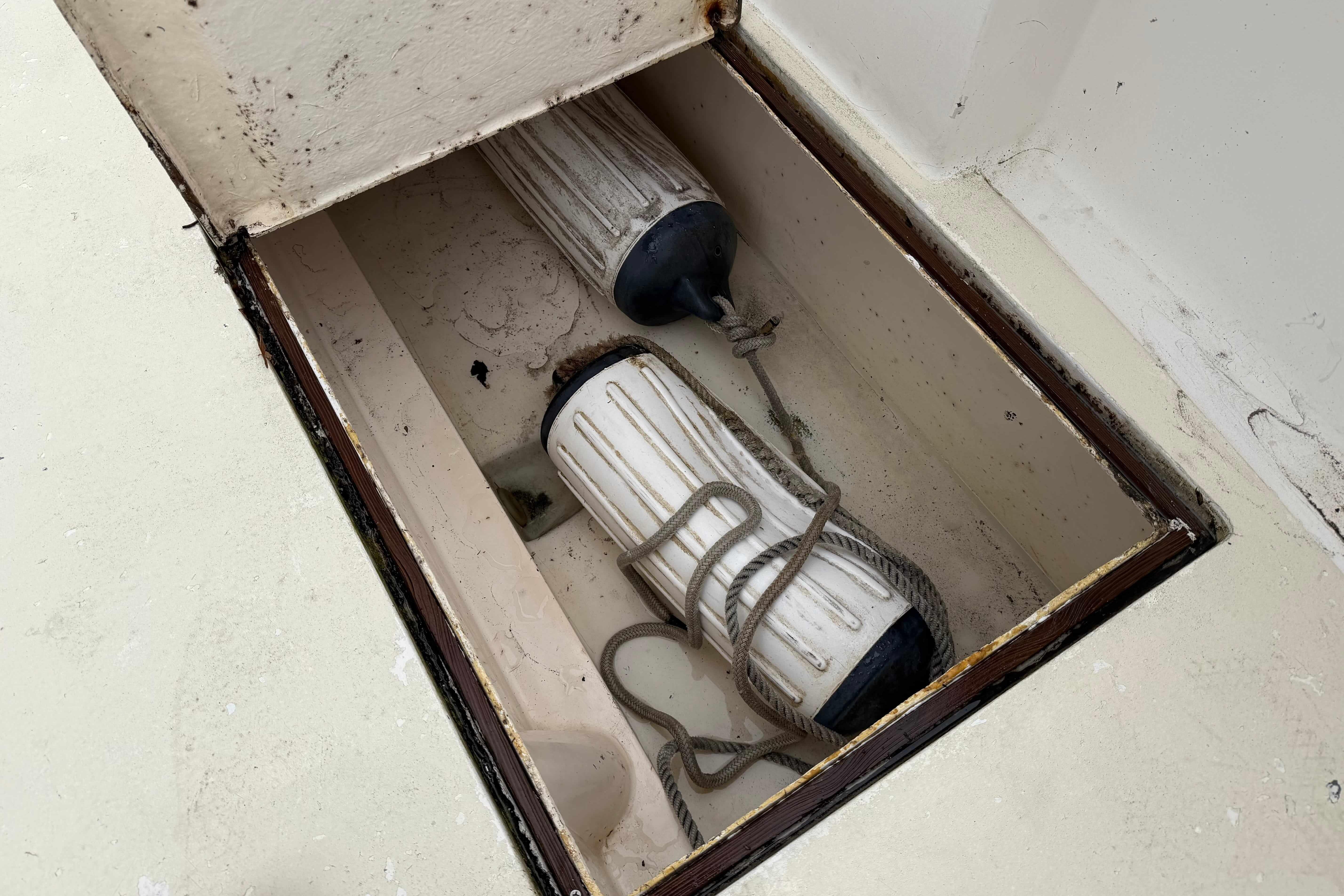 Storage compartment with boat fenders on 1986 Henriques Yachts 35 Maine Coaster.