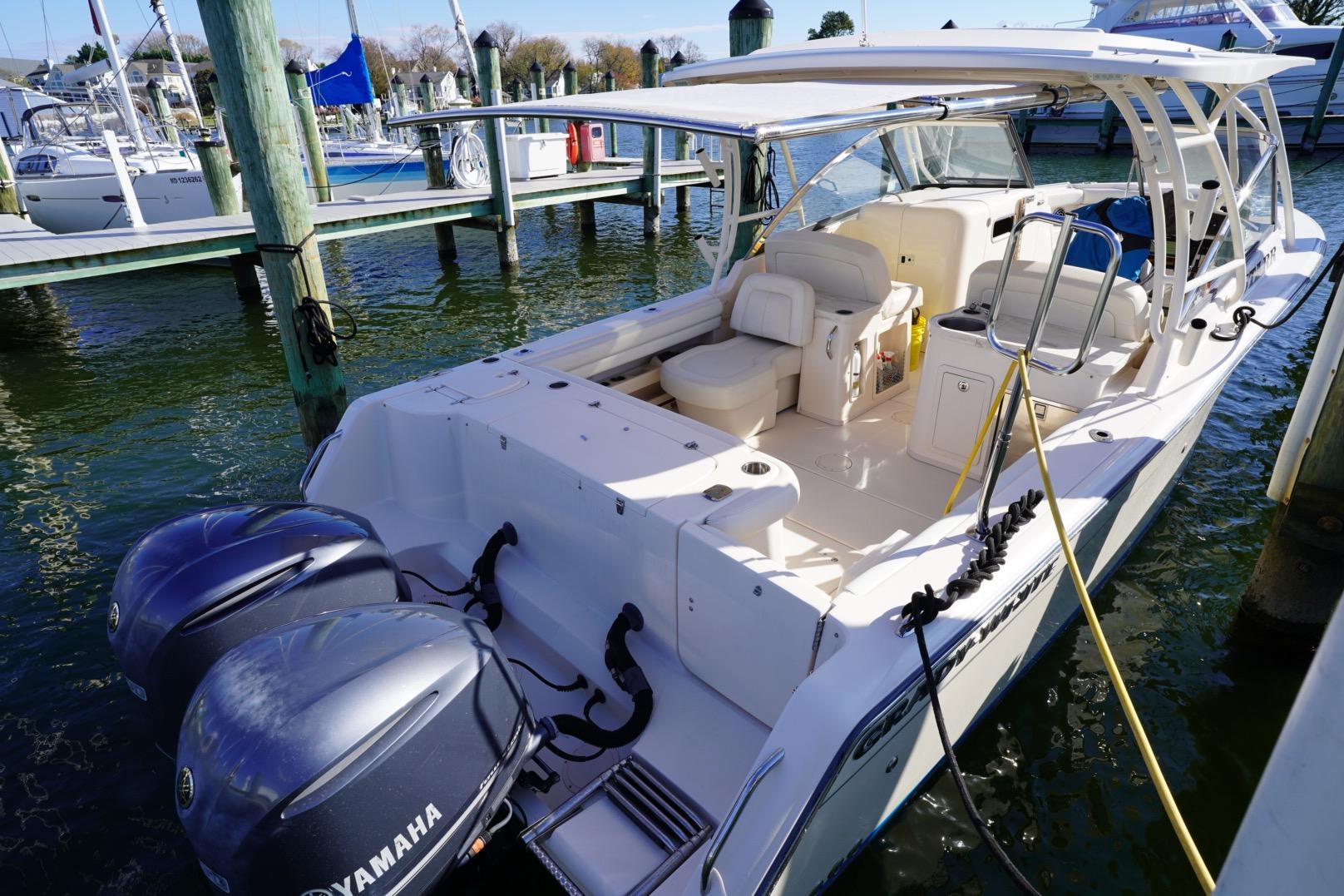 2015 Grady-White Freedom 307 boat docked with twin Yamaha engines.
