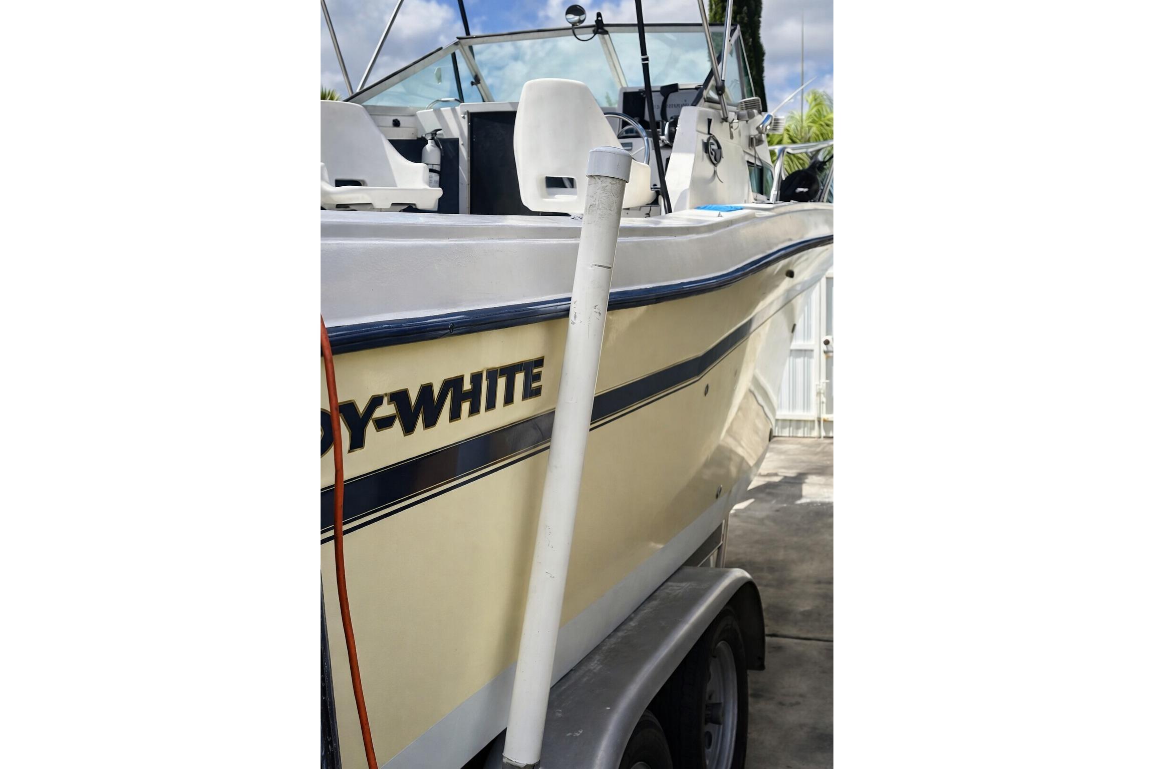 1989 Grady-White Offshore 242 boat on trailer, side view with visible seating.
