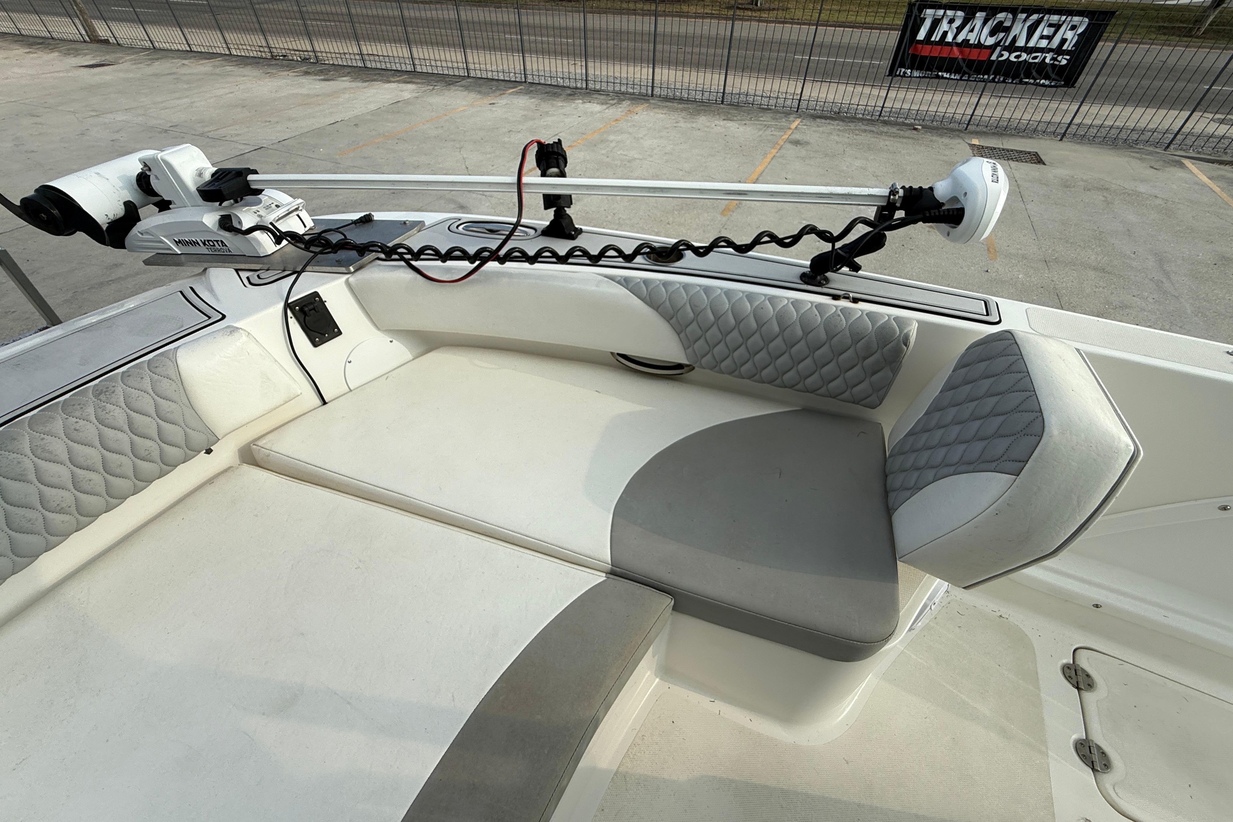 2020 Twin Vee 240 GFX CC boat interior with cushioned seating and trolling motor.