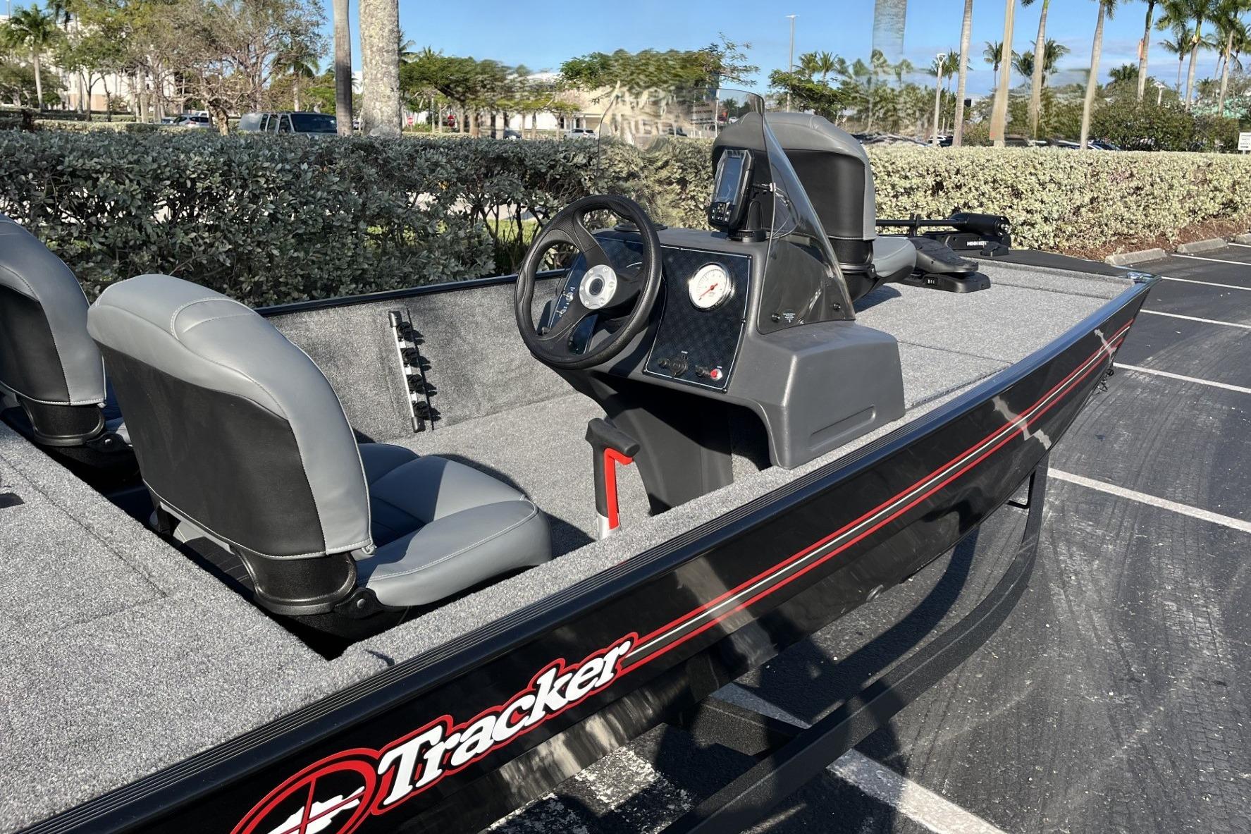 2026 Tracker Bass Tracker Classic XL boat with gray seats and steering console.