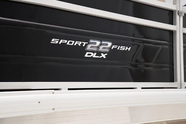 2024 Sun Tracker SportFish 22 DLX logo on black boat panel.
