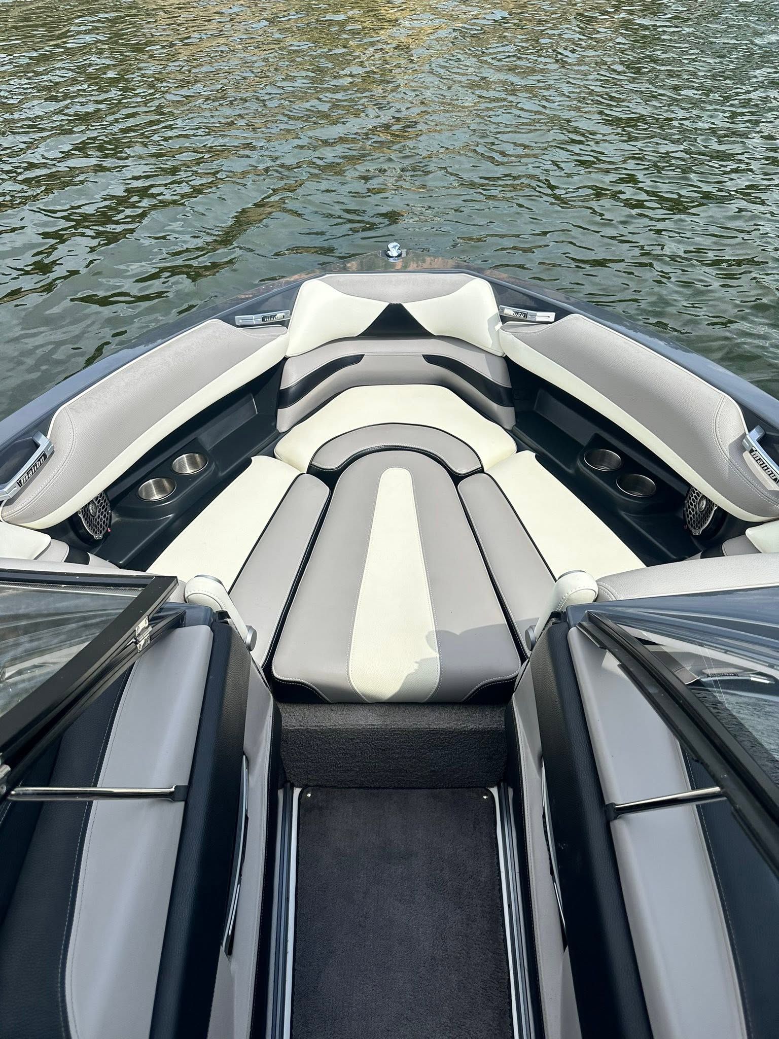 The image shows the interior of a Malibu Wakesetter 23 LSV boat on the water.