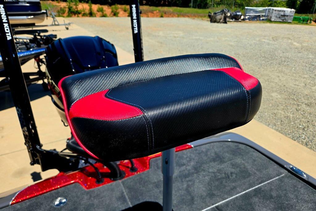 Skeeter ZXE20 2026 boat seat with black and red design, outdoor setting.